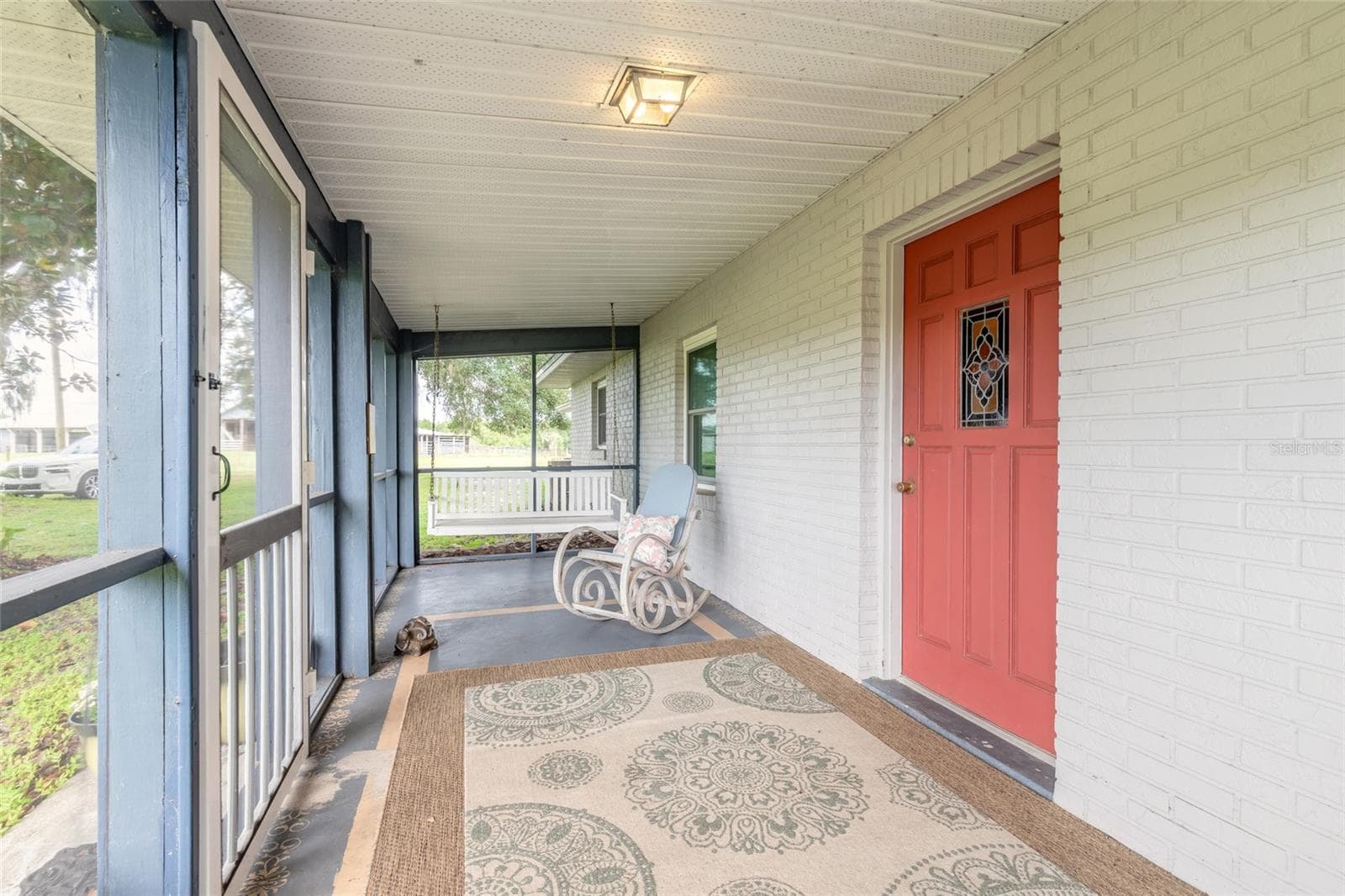 Screened front porch - 1390 E OHIO AVE, LAKE HELEN