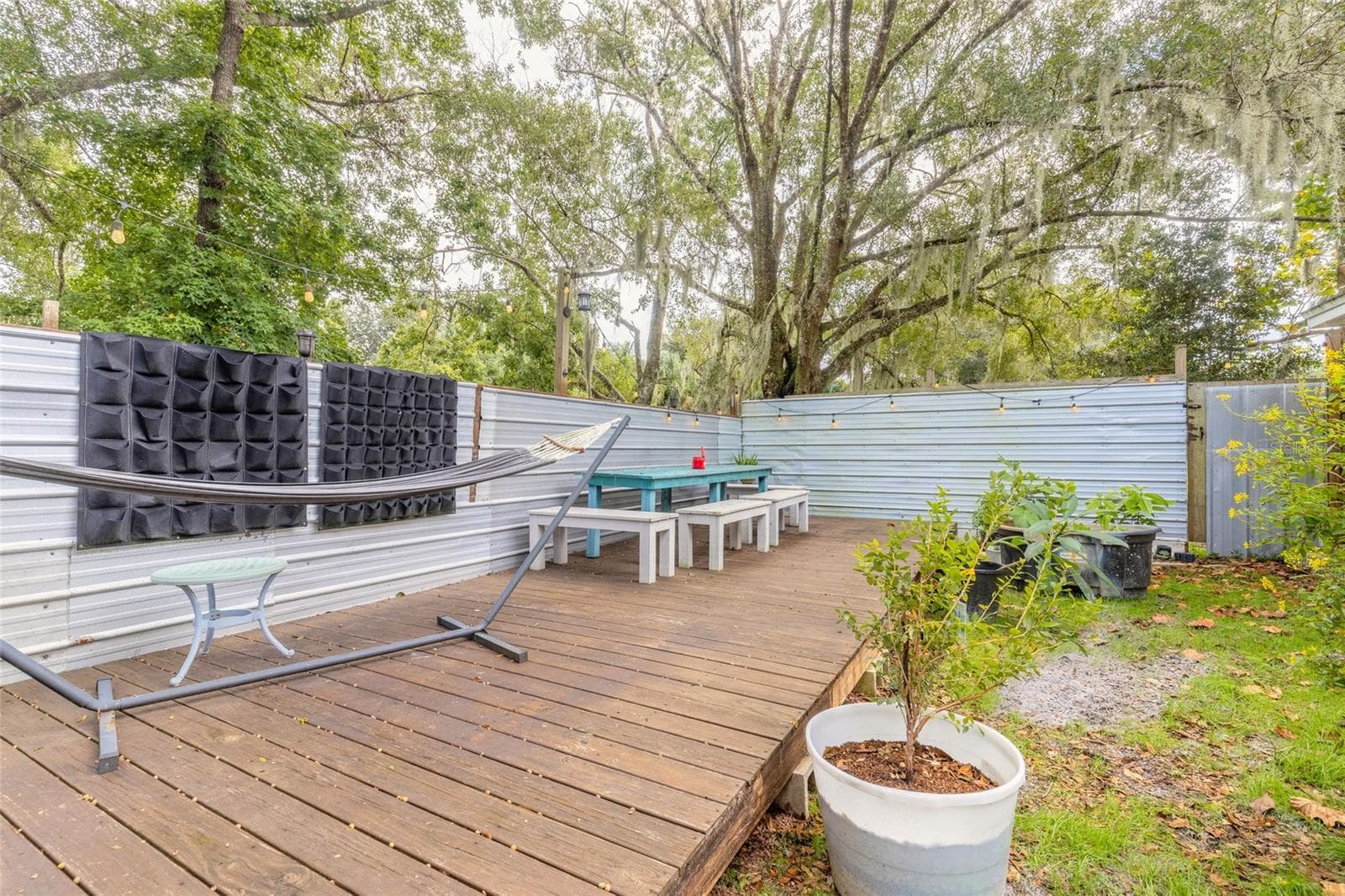 Portion of backyard fenced with deck - 1390 E OHIO AVE, LAKE HELEN