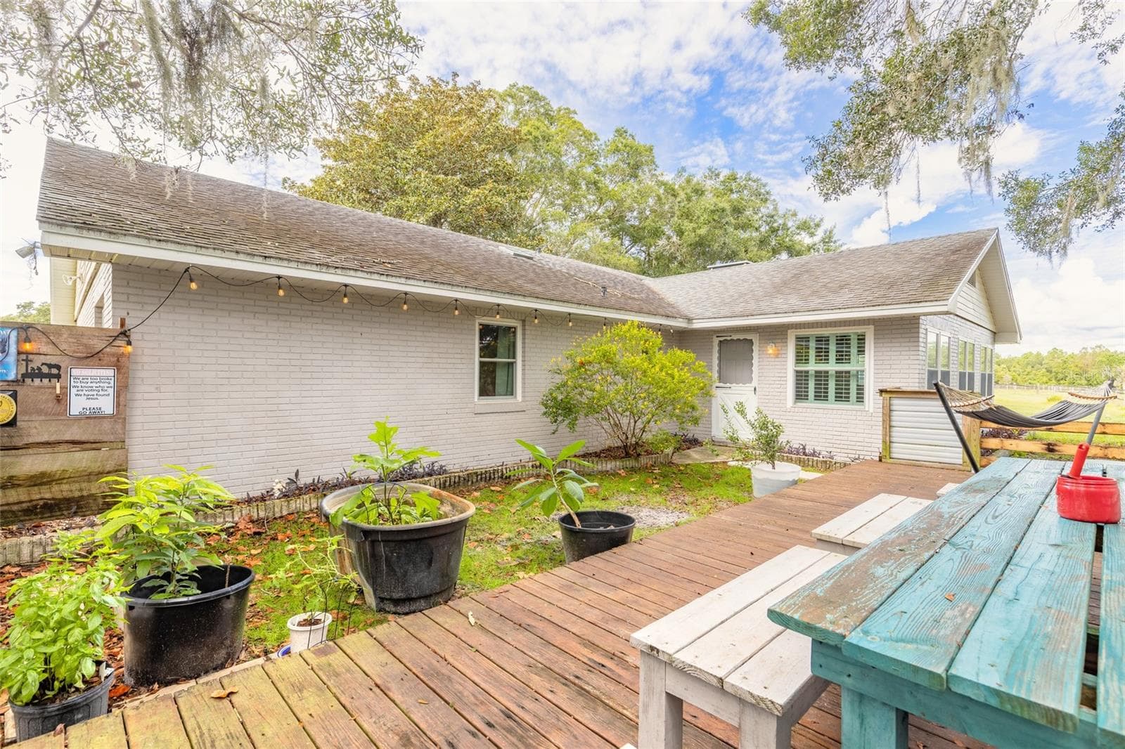 Portion of backyard fenced with deck - 1390 E OHIO AVE, LAKE HELEN
