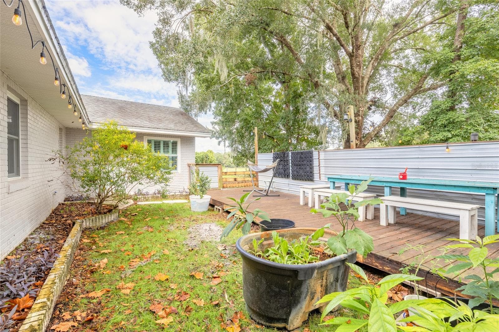 Portion of backyard fenced with deck - 1390 E OHIO AVE, LAKE HELEN