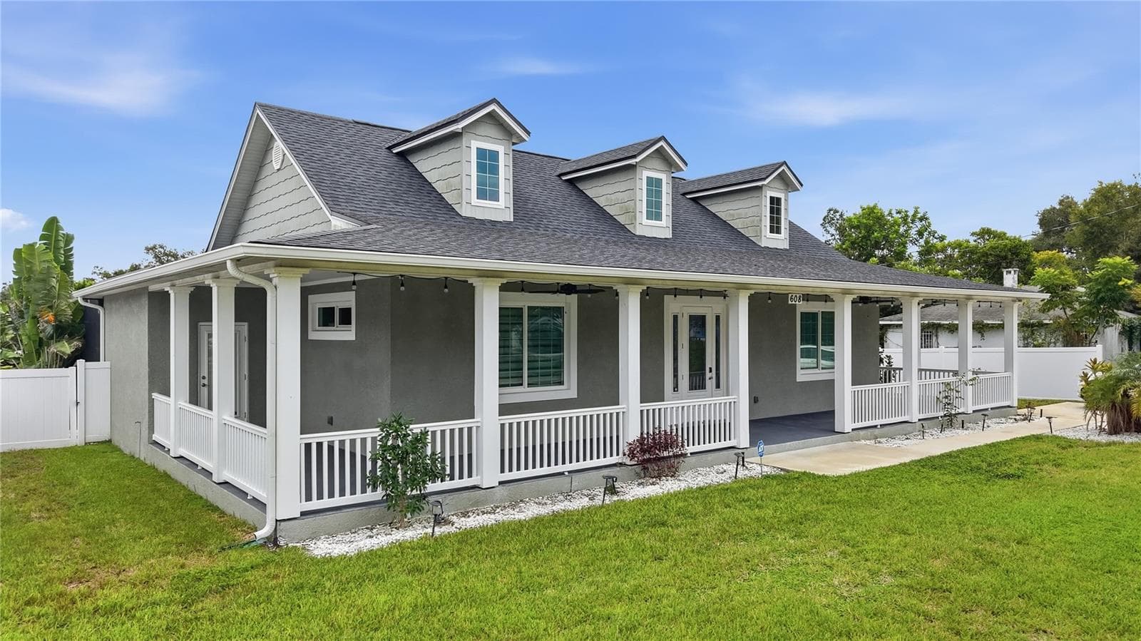 Front of home with 1,100 sq ft wrap around porch - 608 4TH ST SW, LARGO