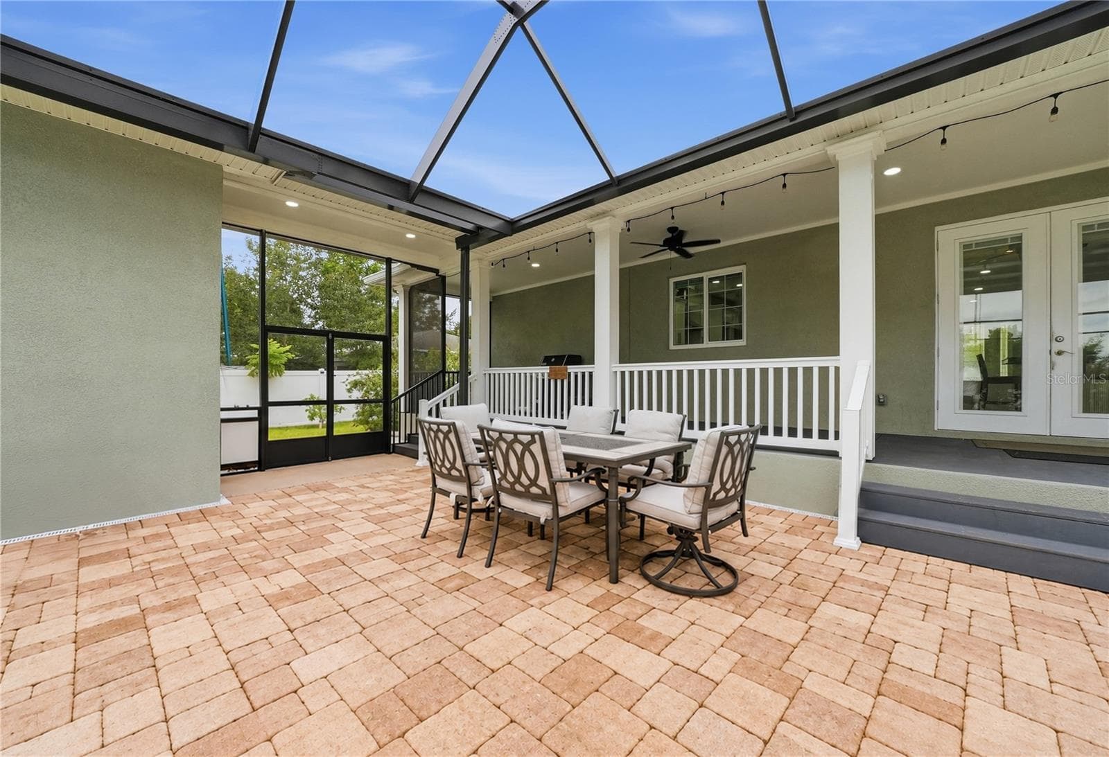 Covered porch overlooking screened lanai - 608 4TH ST SW, LARGO