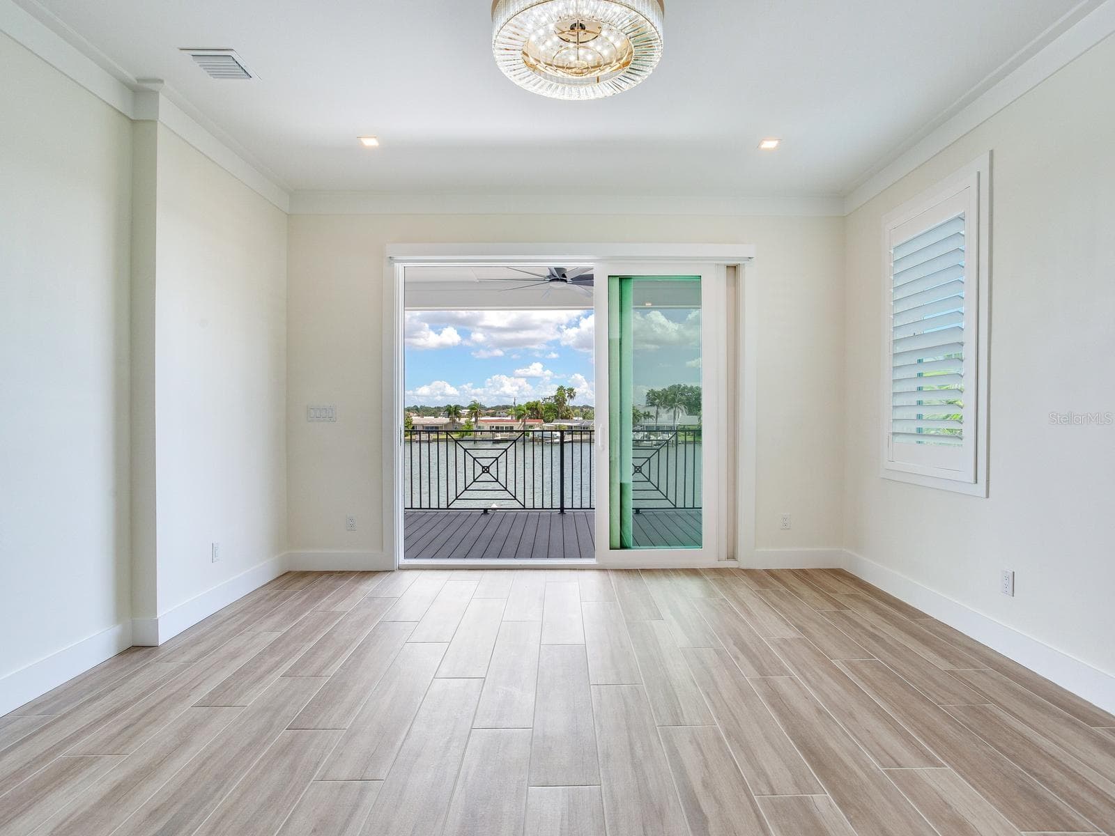Bedroom of an already built SeaSafe Shore Crest home for reference purposes only. - 4 BELLEVUE DR, TREASURE ISLAND