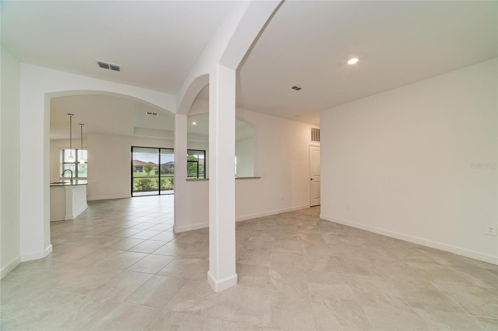 dining room on the right - 15332 SERENE SHORES LOOP, BRADENTON