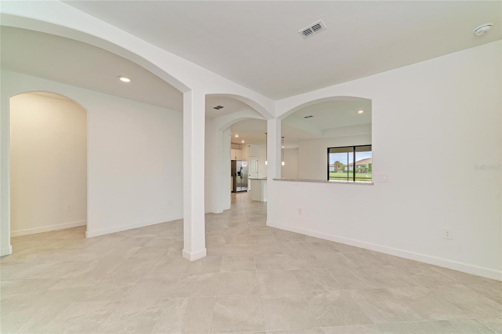 dining room looking into great room - 15332 SERENE SHORES LOOP, BRADENTON