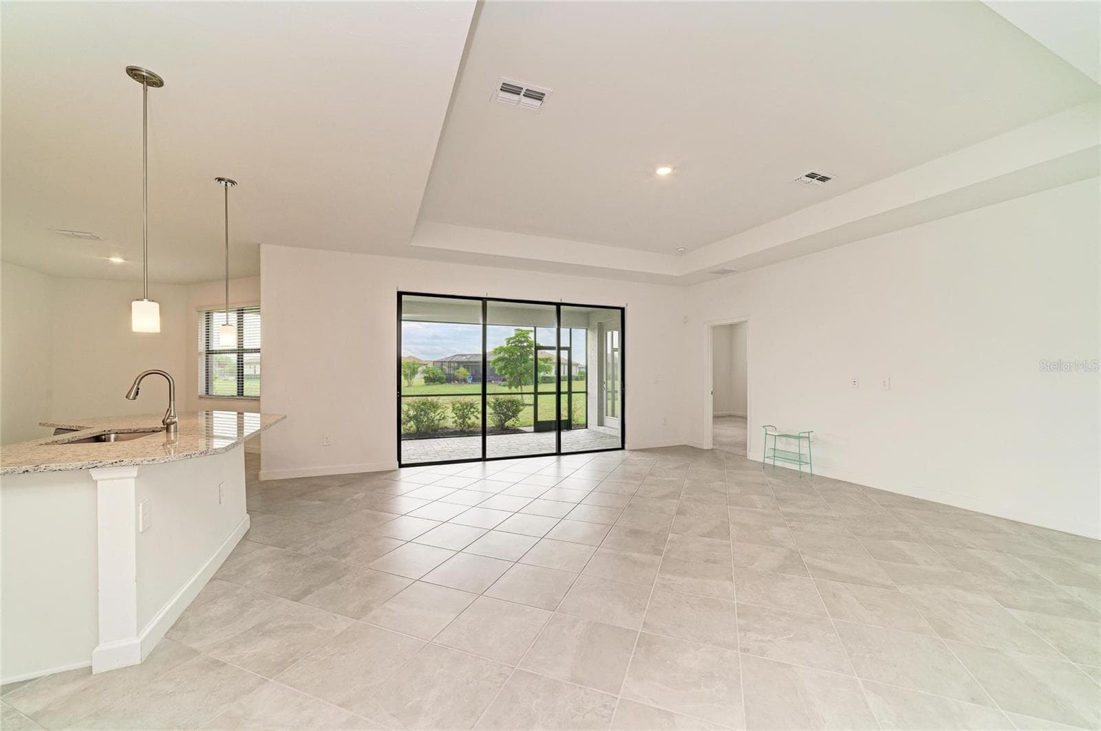 Main living area with trey ceiling - 15332 SERENE SHORES LOOP, BRADENTON