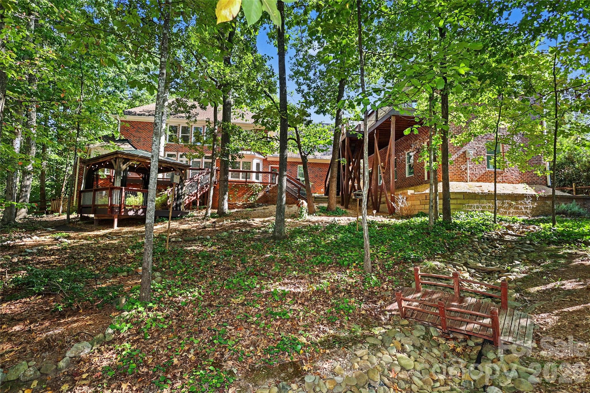 Private yard with mature landscaping on a .72 acre lot - 4320 Town And Country Drive, Charlotte