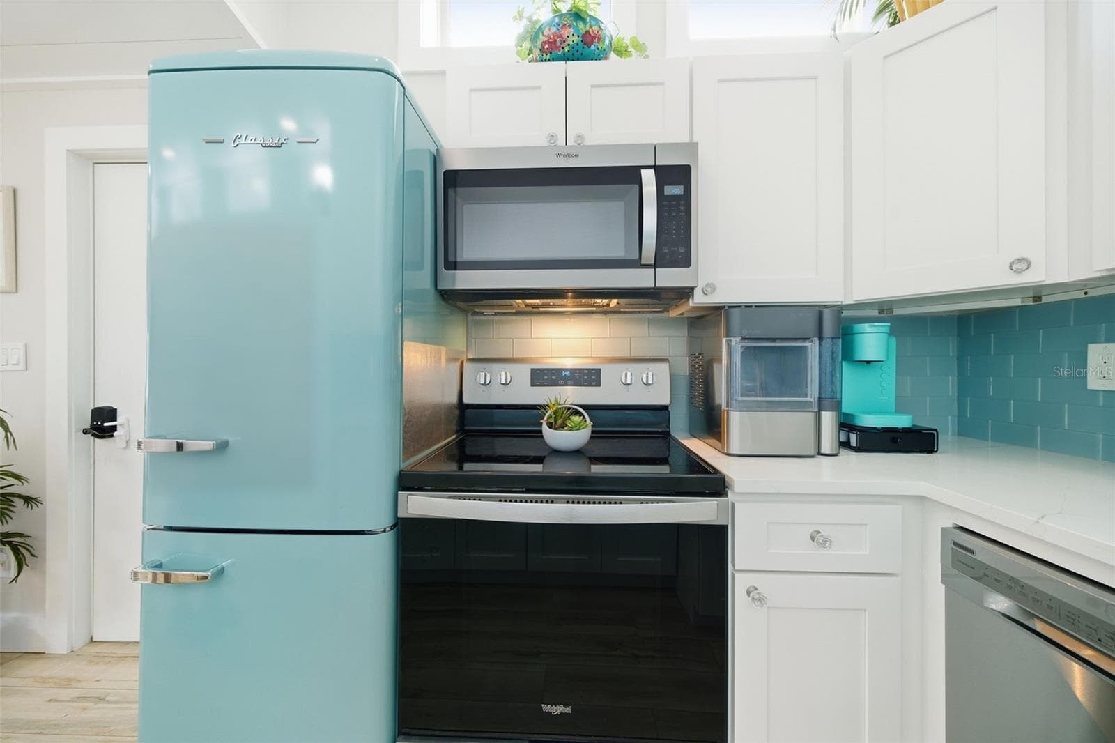 Thoughtfully equipped kitchen w/countertop ice maker and dedicated coffee station - 5837 TENNESSEE AVE, NEW PORT RICHEY