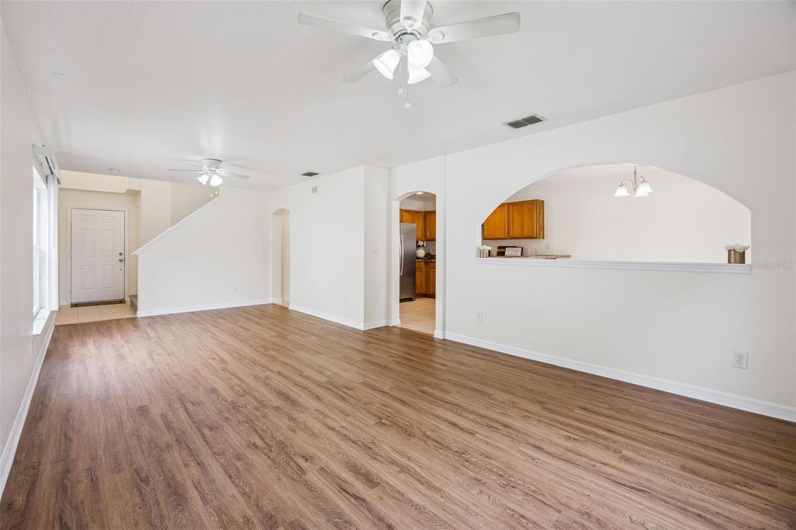 Family room open to the dining room and foyer - 2020 PORTCASTLE CIR, WINTER GARDEN
