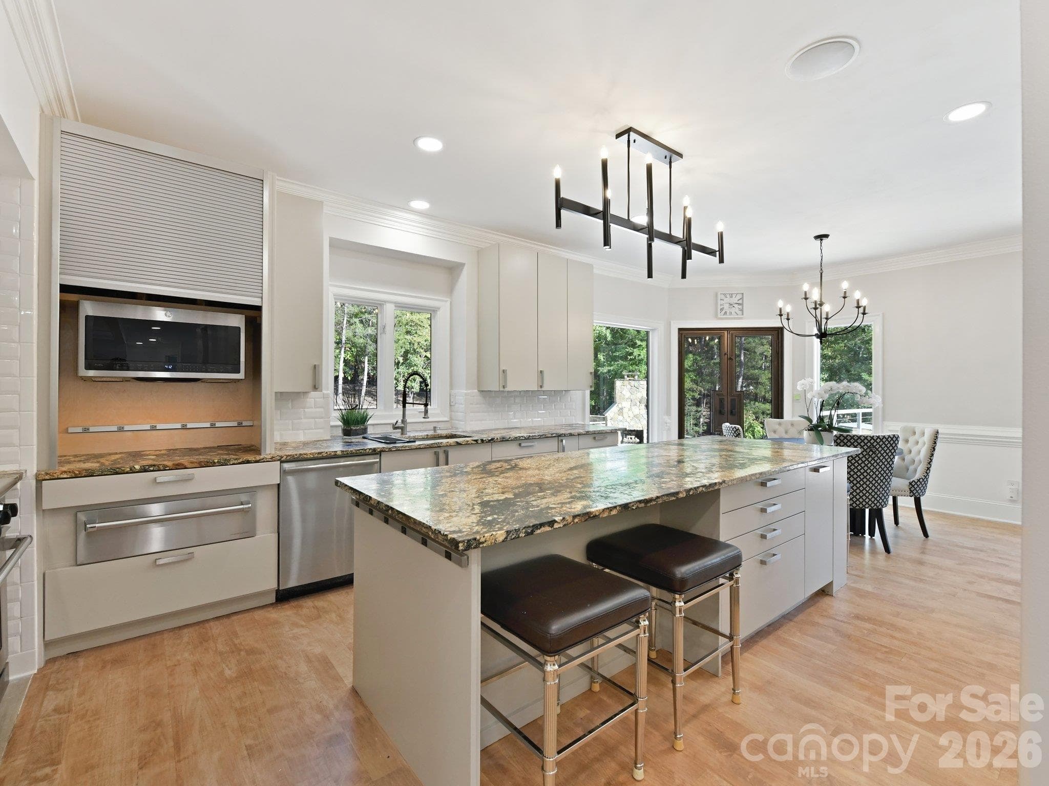 Gorgeous island with Magma gold leathered granite countertops & bar seating on 3 sides. - 2723 Providence Pine Lane, Charlotte