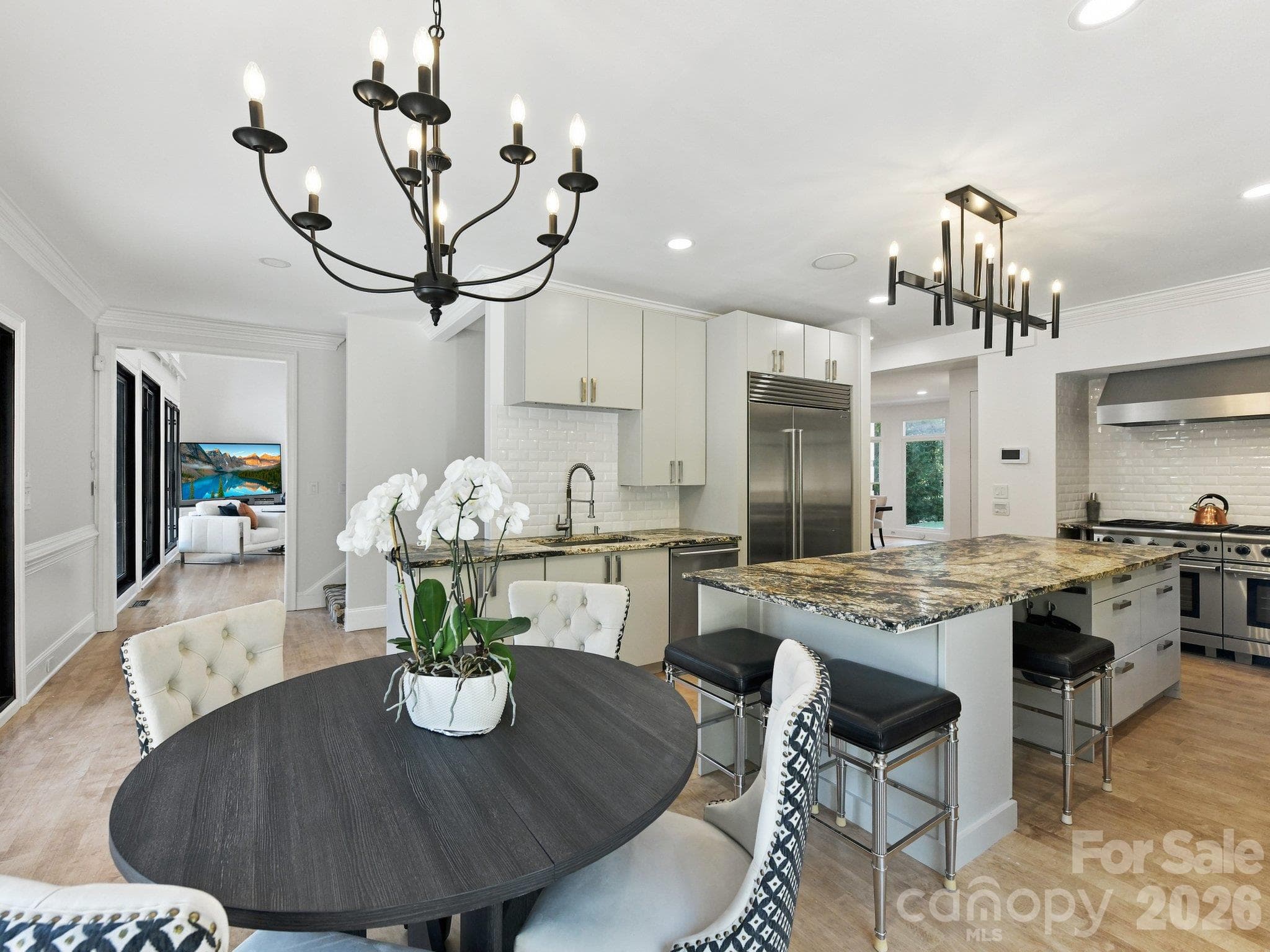 A spacious breakfast nook with doors which open directly onto the terrace. - 2723 Providence Pine Lane, Charlotte