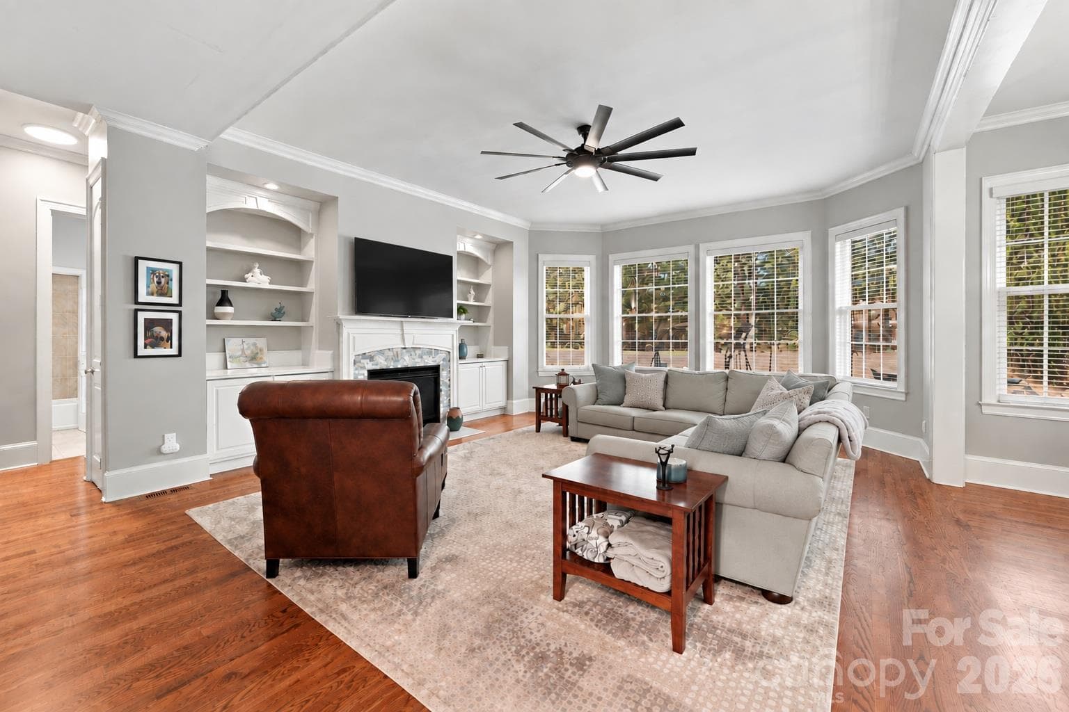 Great room is the room where everyone will want to be. Large enough for a substantial sectional and additional seating, the great room gives family and friends plenty of room to relax, watch a movie, catch the big game or spend an evening together without feeling crowded. - 2309 Highland Forest Drive, Waxhaw
