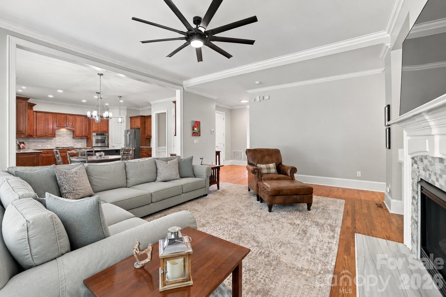 Designed for the way people really live, this spacious great room is just steps from the kitchen and casual dining area, making it easy to move from dinner to movie night or accommodate a houseful of family and friends. - 2309 Highland Forest Drive, Waxhaw