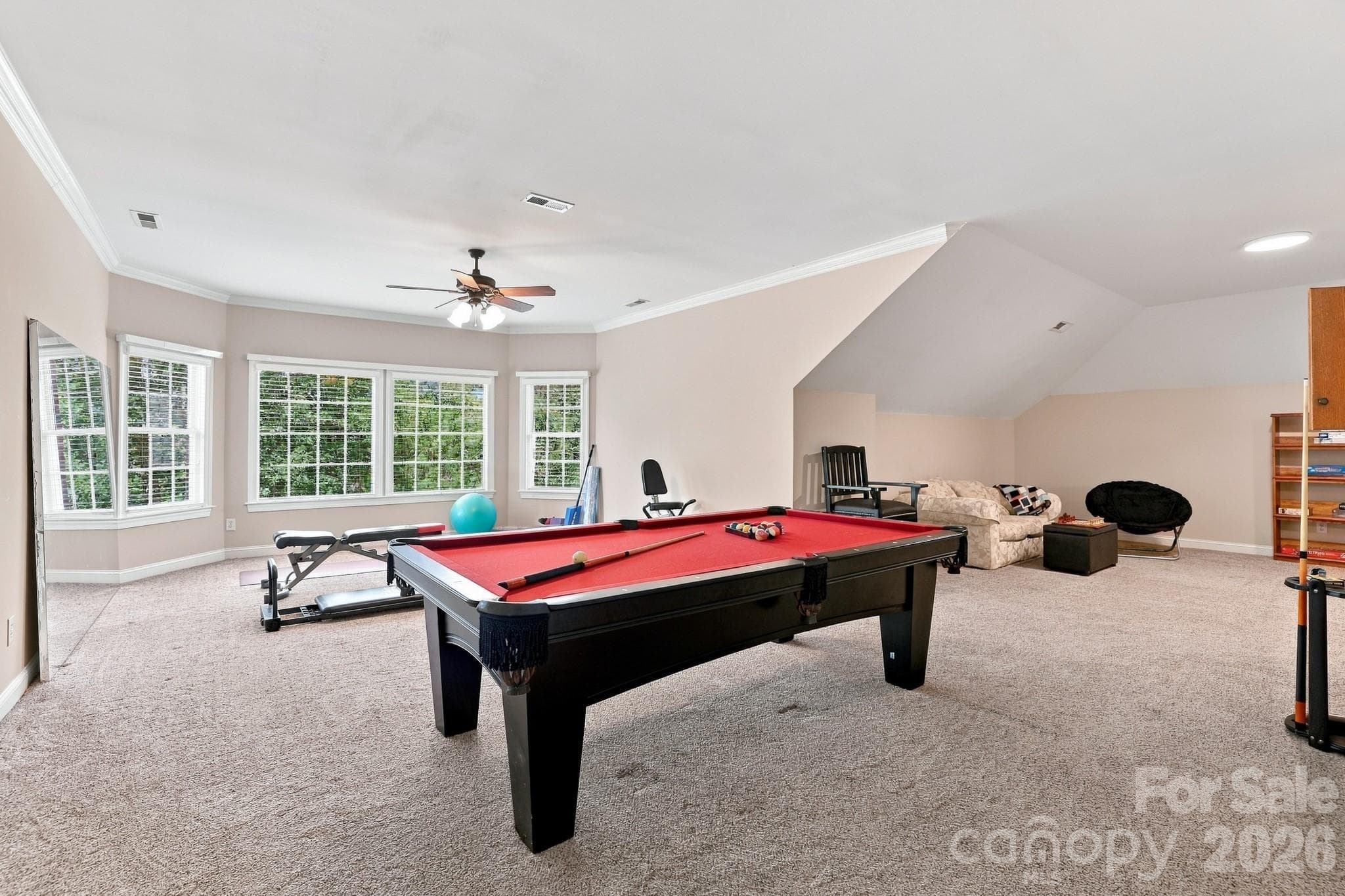 The finished third floor adds tremendous flexibility to the home, with room for a full-size pool table and plenty of additional space for games, hobbies or a home gym. Whether devoted entirely to recreation or divided into different activity areas, there’s room here to make this level work for the way you live. - 2309 Highland Forest Drive, Waxhaw