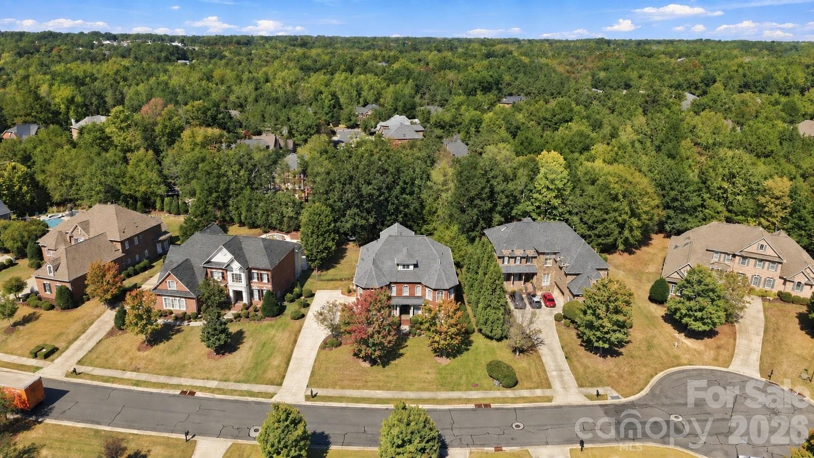One look from above and you can see why the setting matters. 2309 Highland Forest Drive sits on a cul-de-sac street in Weddington Chase, surrounded by impressive homes and mature trees that stretch across the landscape in every direction. It’s a beautiful setting in one of Union County’s most sought-after communities. - 2309 Highland Forest Drive, Waxhaw