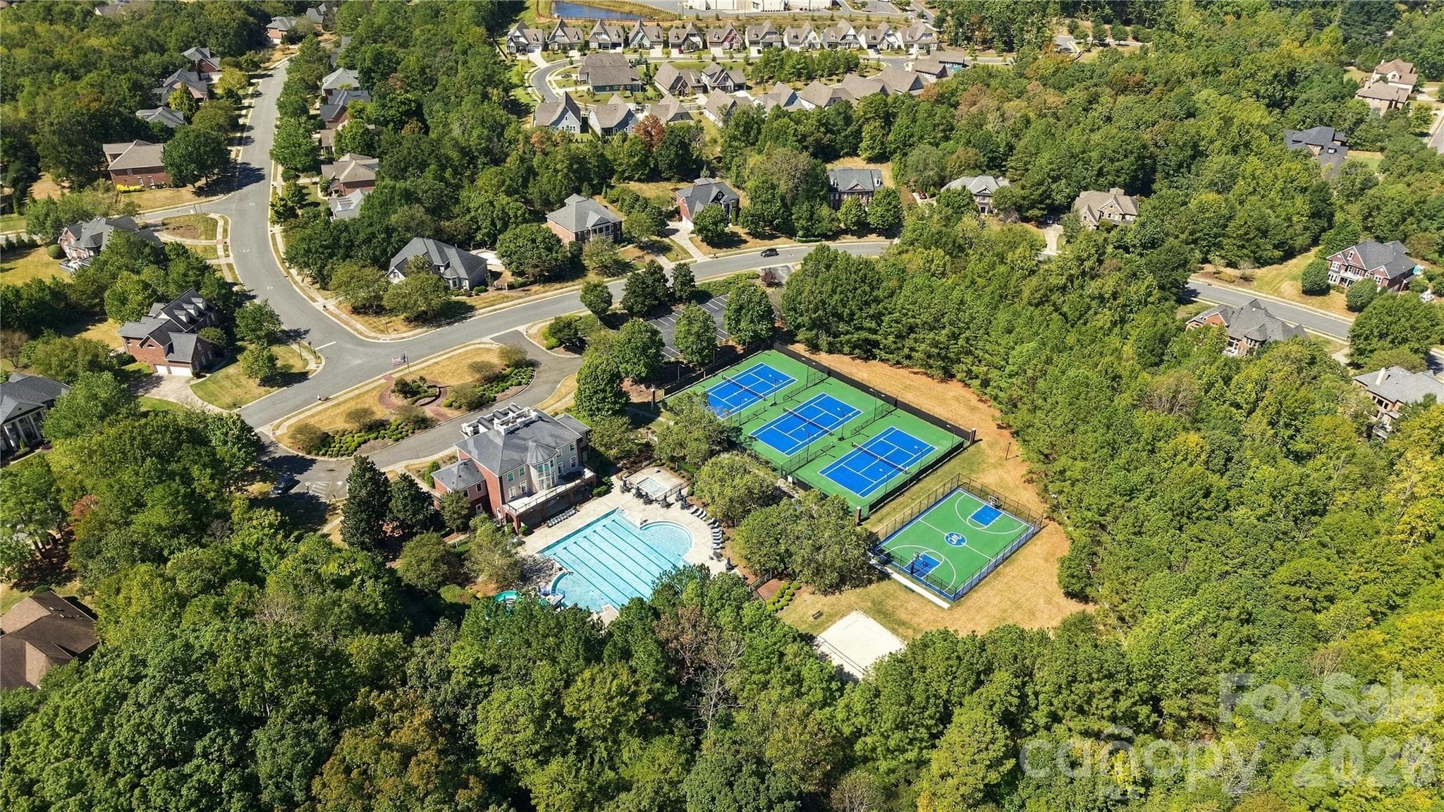 Weddington Chase offers an exceptional range of amenities for an active lifestyle, including clubhouse, pool, tennis, basketball courts, playground, fitness center, sand volleyball, walking trails. - 2309 Highland Forest Drive, Waxhaw
