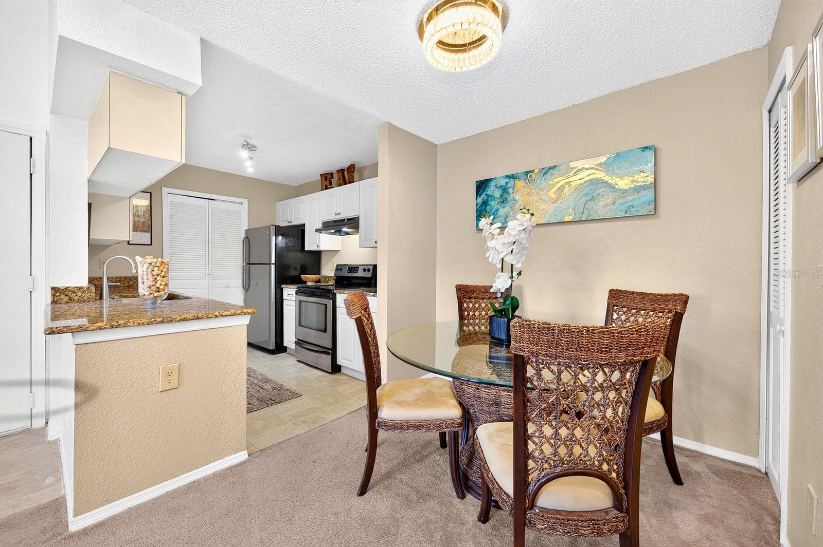 A charming Dining Room sits just off the Kitchen. - 2550 N ALAFAYA TRL #6303, ORLANDO