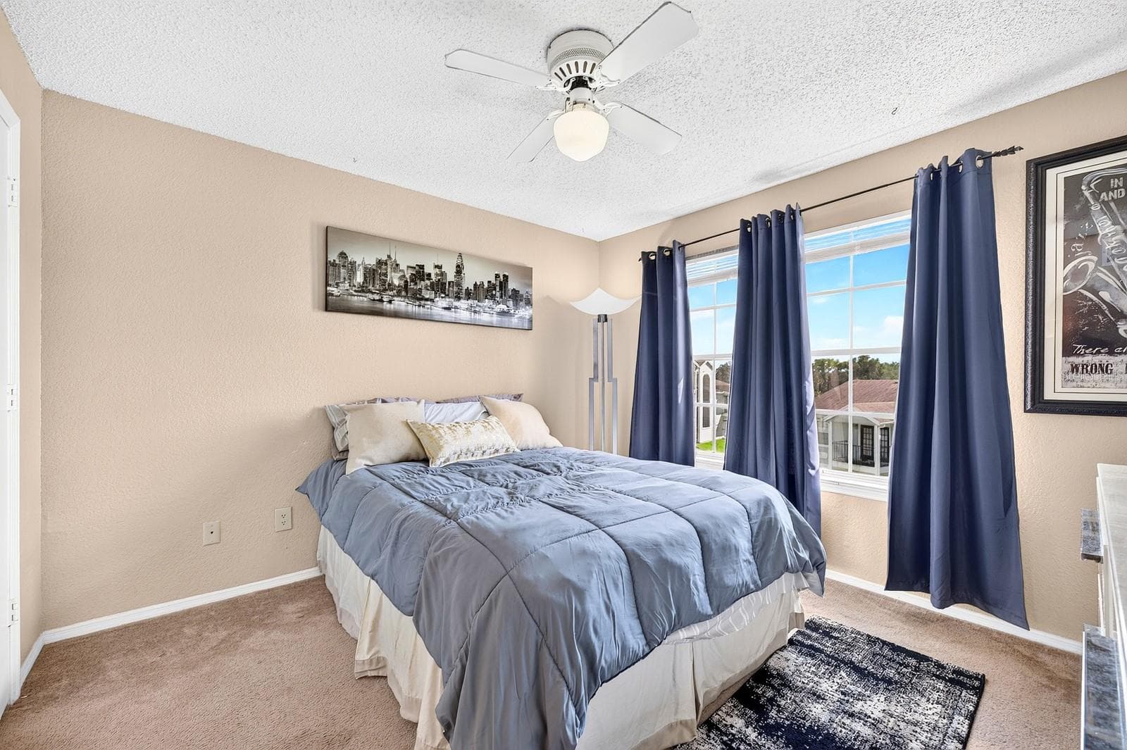 The spacious Bedroom is filled with NATURAL LIGHT from large windows and offers a pleasant outlook. - 2550 N ALAFAYA TRL #6303, ORLANDO