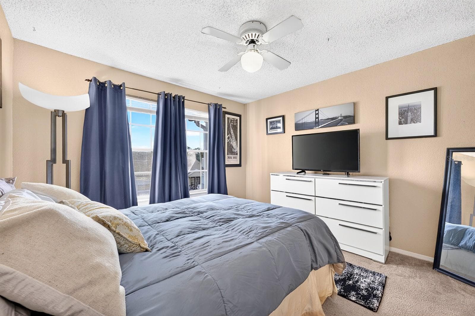 The spacious Bedroom is filled with NATURAL LIGHT from large windows and offers a pleasant outlook. - 2550 N ALAFAYA TRL #6303, ORLANDO
