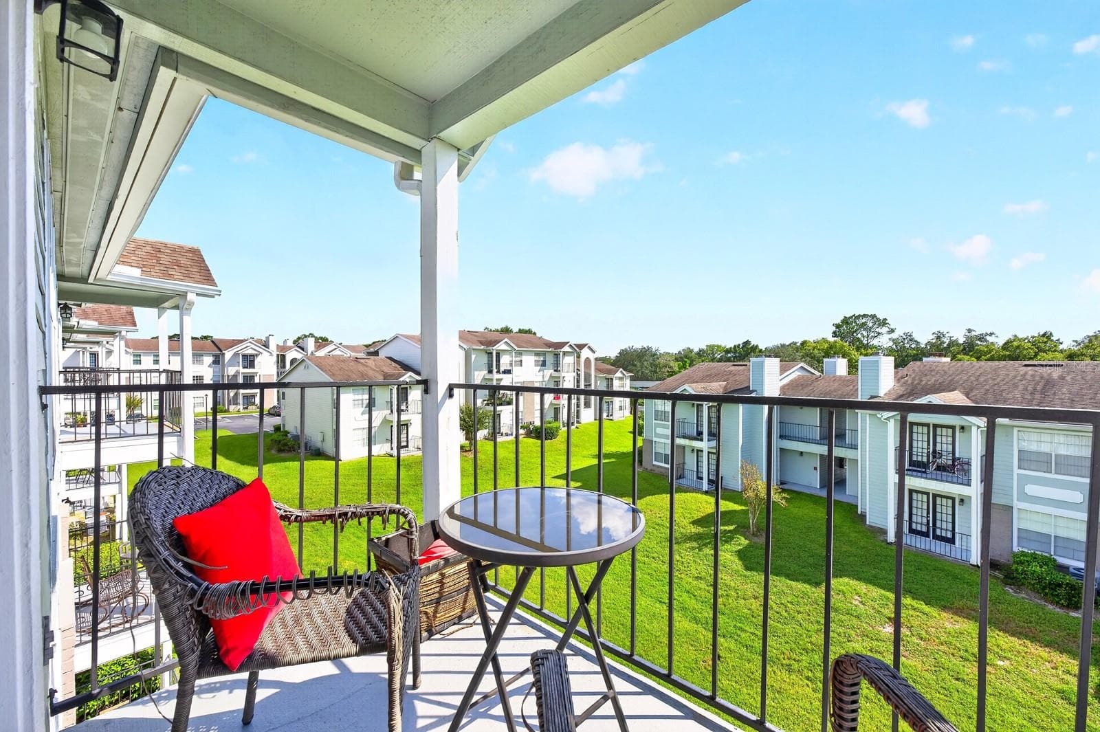Overlooking GREEN SPACE, the balcony offers a peaceful spot to enjoy your morning coffee, unwind after a busy day or simply take in the view. - 2550 N ALAFAYA TRL #6303, ORLANDO