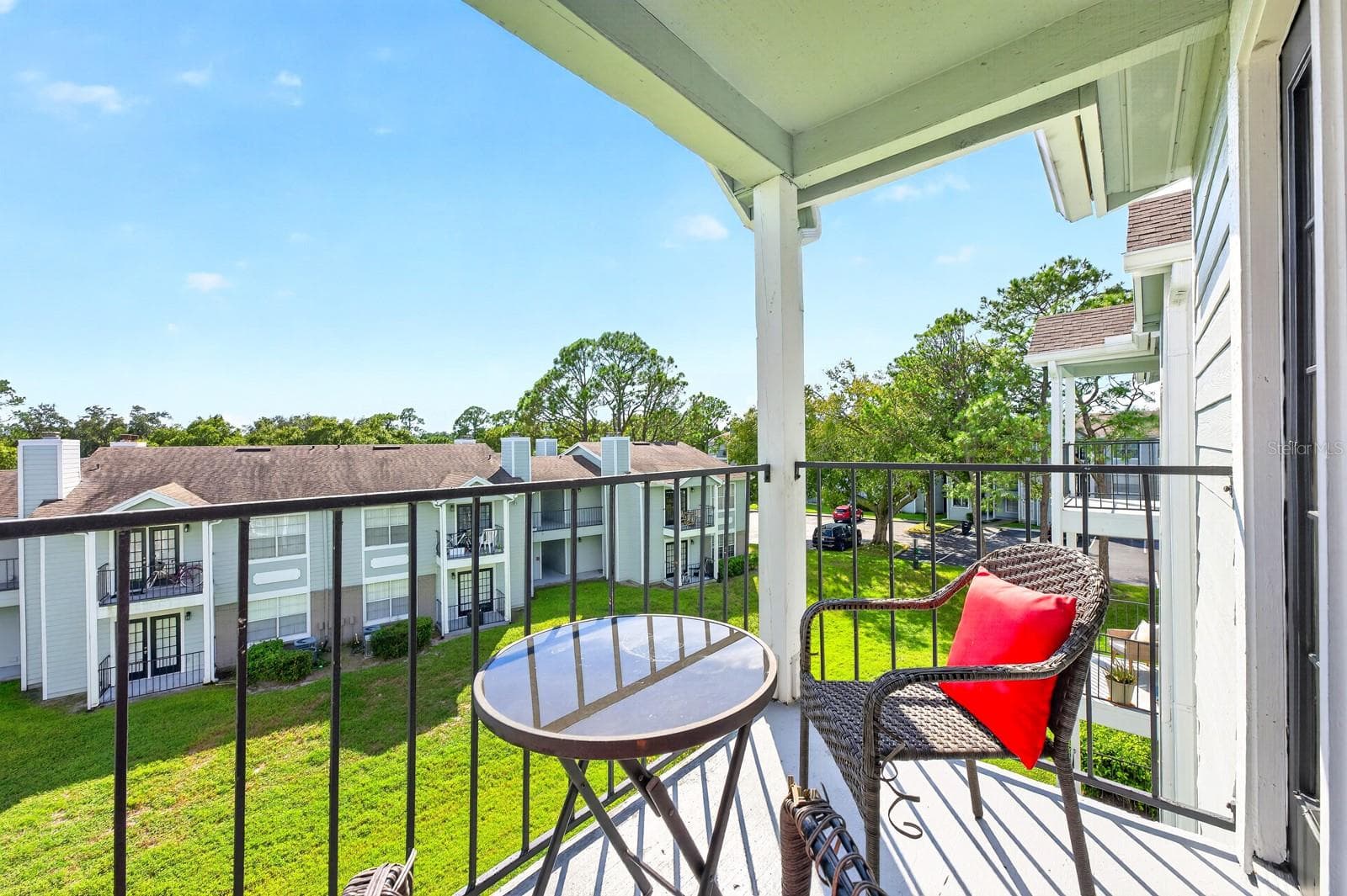 Overlooking GREEN SPACE, the balcony offers a peaceful spot to enjoy your morning coffee, unwind after a busy day or simply take in the view. - 2550 N ALAFAYA TRL #6303, ORLANDO