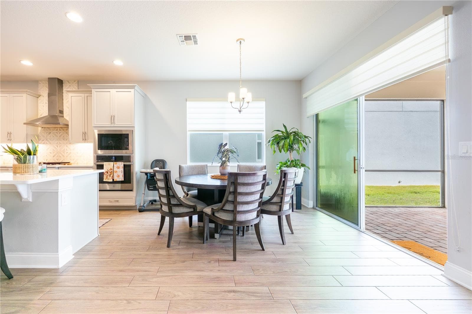 Inviting breakfast nook beside the kitchen, with sliding glass doors opening to the covered patio. - 1316 SOUTHERN SUN DRIVE, OAKLAND