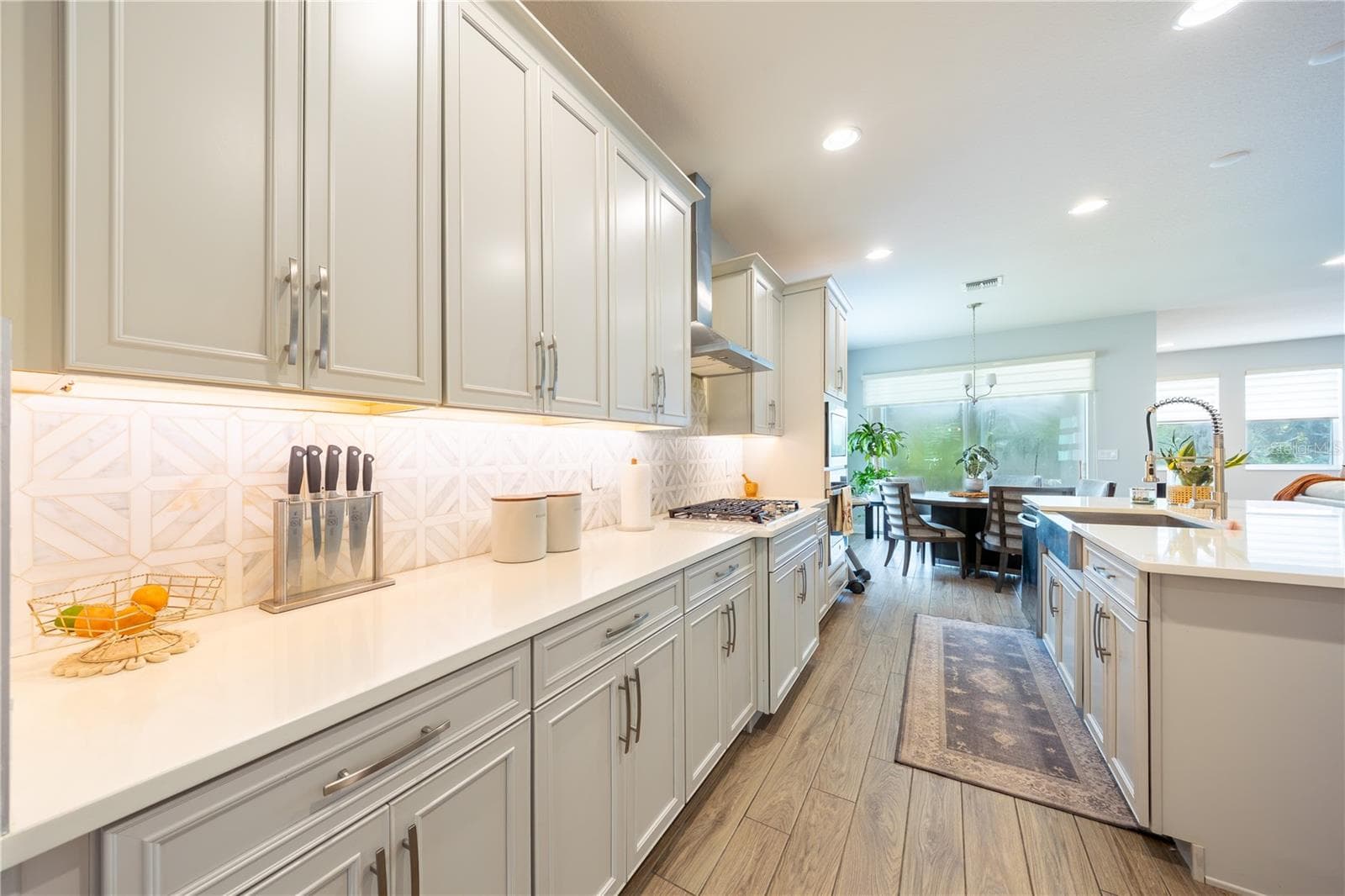 efined kitchen with expansive countertops, ample cabinetry, and a gas cooktop. - 1316 SOUTHERN SUN DRIVE, OAKLAND