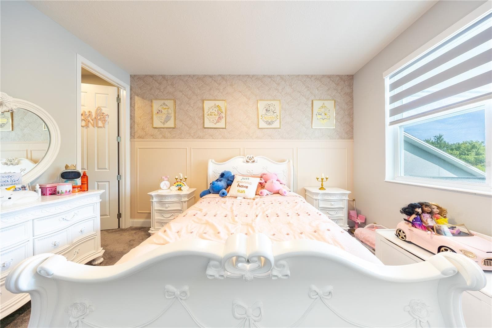 Charming bedroom with decorative wall paneling, patterned wallpaper, and a large window. - 1316 SOUTHERN SUN DRIVE, OAKLAND