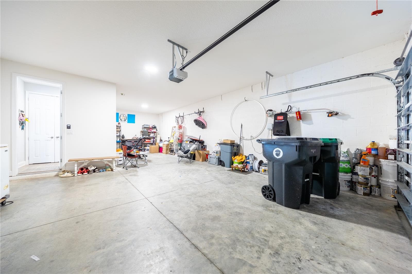 Spacious garage with direct home access and additional room for storage or a workshop. - 1316 SOUTHERN SUN DRIVE, OAKLAND