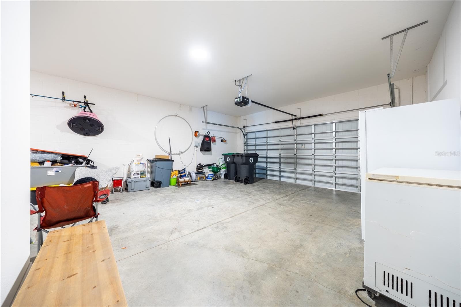 Spacious two-car garage with an automatic door opener and room for additional storage. - 1316 SOUTHERN SUN DRIVE, OAKLAND