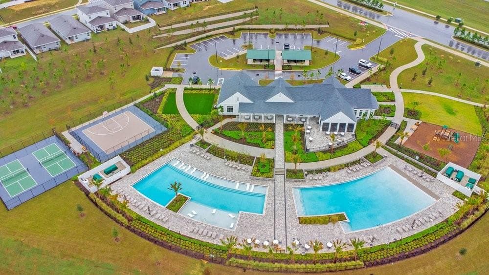 Incredible new Amenities Center with 2 resort style pools, playground, dogpark, pickleball courts, fitness center, and indoor and outdoor kitchens - 2378 GOLD DUST DR, MINNEOLA