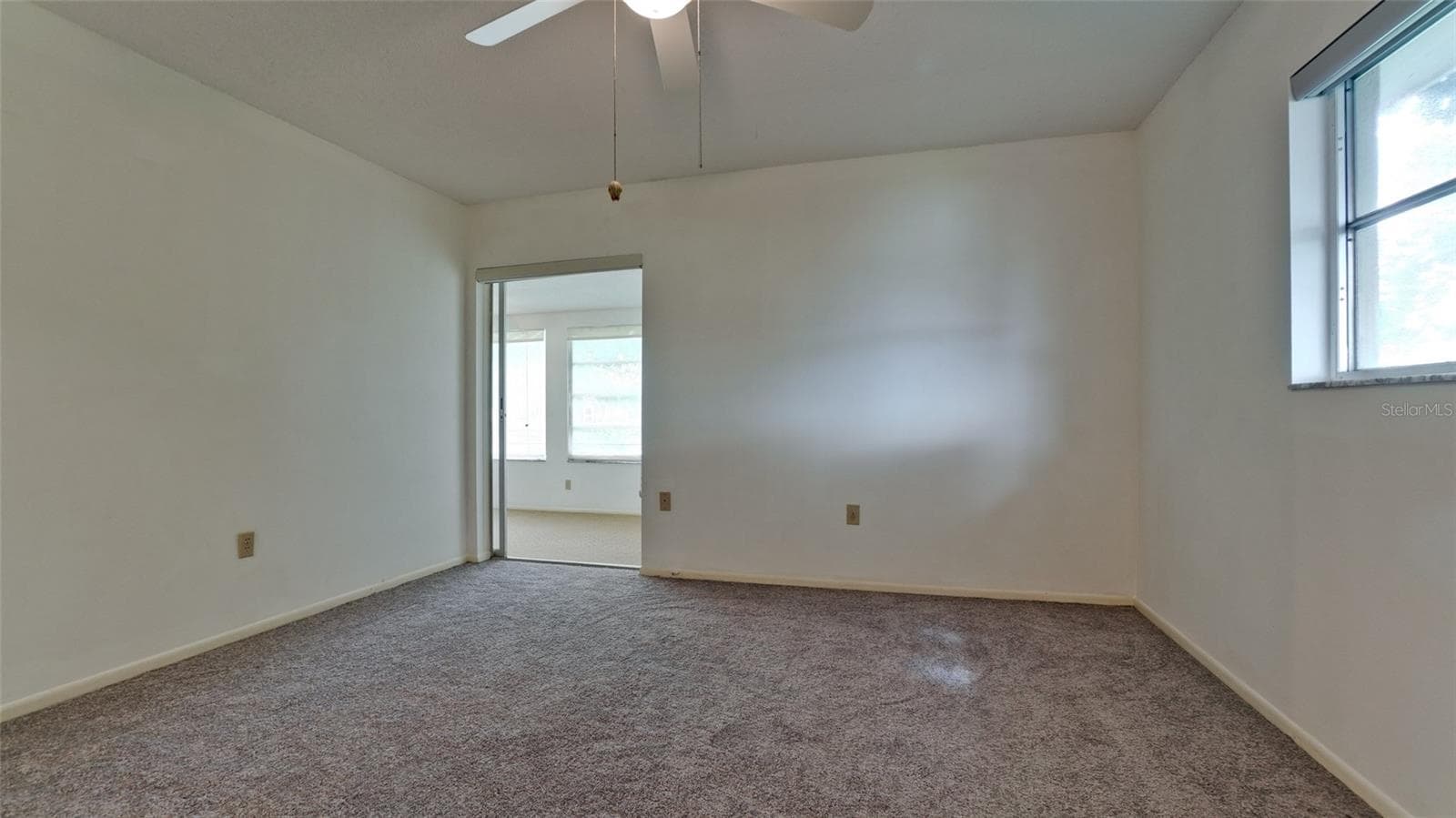 Large primary in the rear of the home with a slider out to the large lanai - 7110 11TH AVE W, BRADENTON