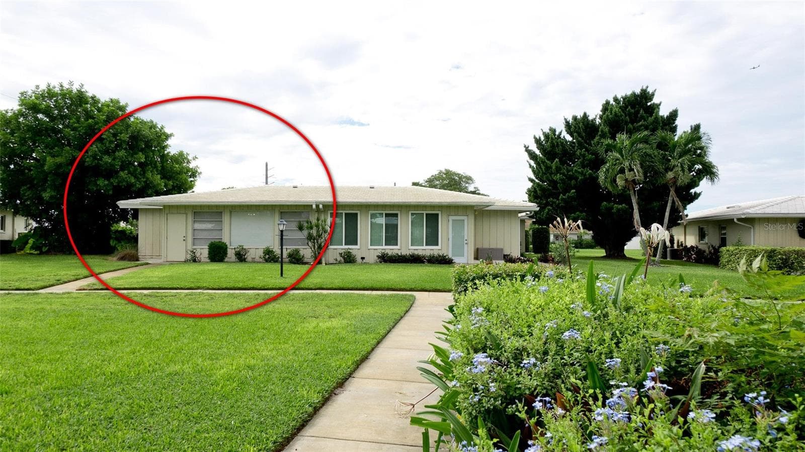Rear of home with door access to the paths & pool - 7110 11TH AVE W, BRADENTON