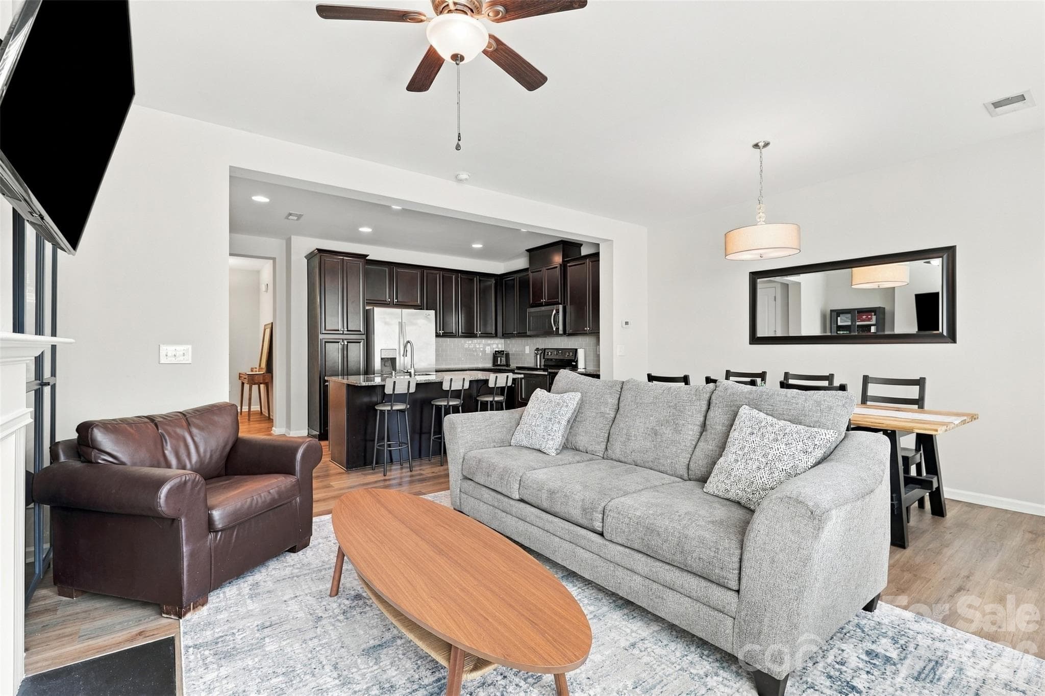 Cozy living room surrounded by a gas fireplace; great natural light! - 1020 Archibald Avenue, Fort Mill