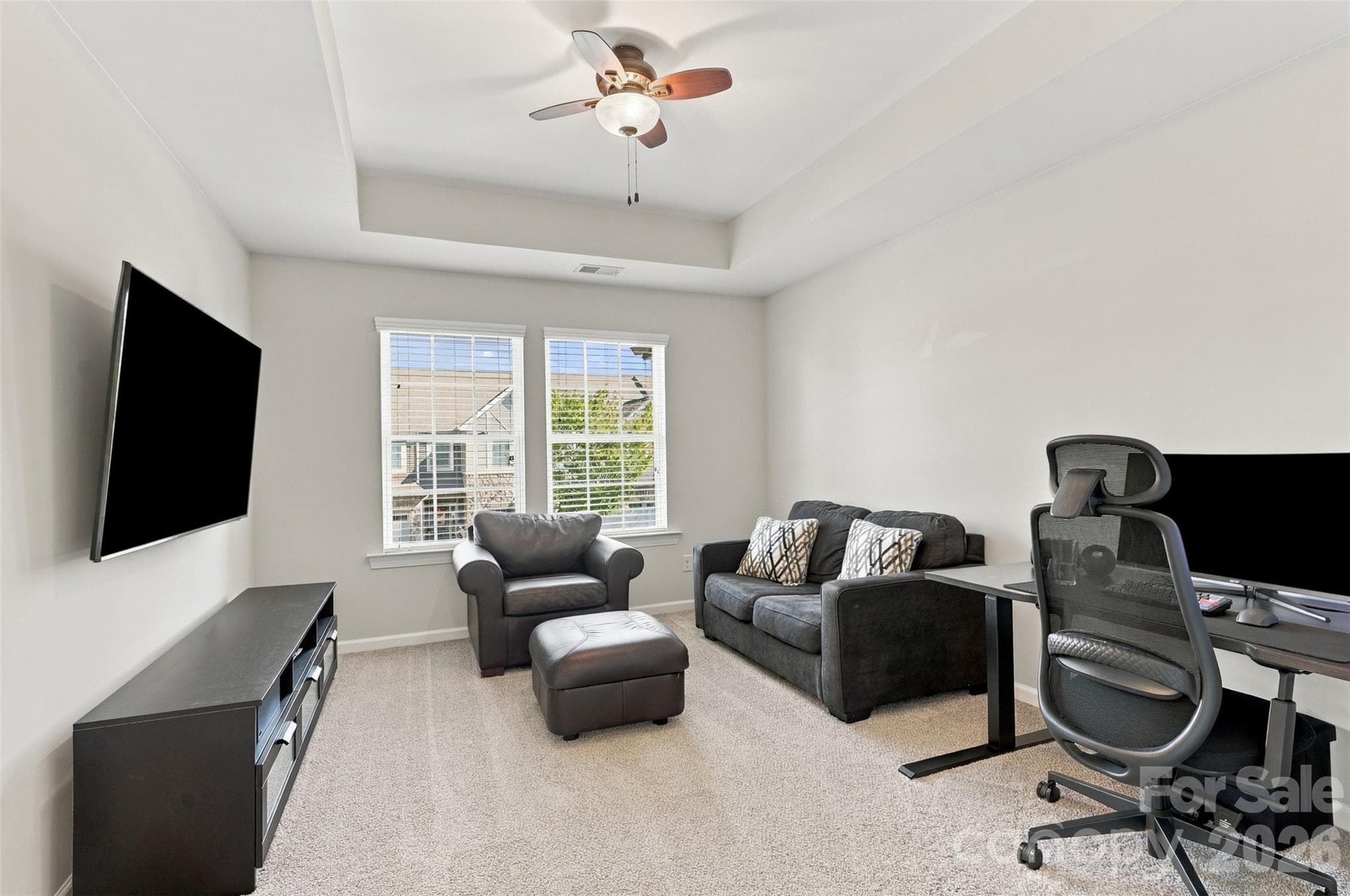 Bedroom 1- tray ceiling, ensuite bath with tiled floors, dual vanity, & tub/shower combo! - 1020 Archibald Avenue, Fort Mill