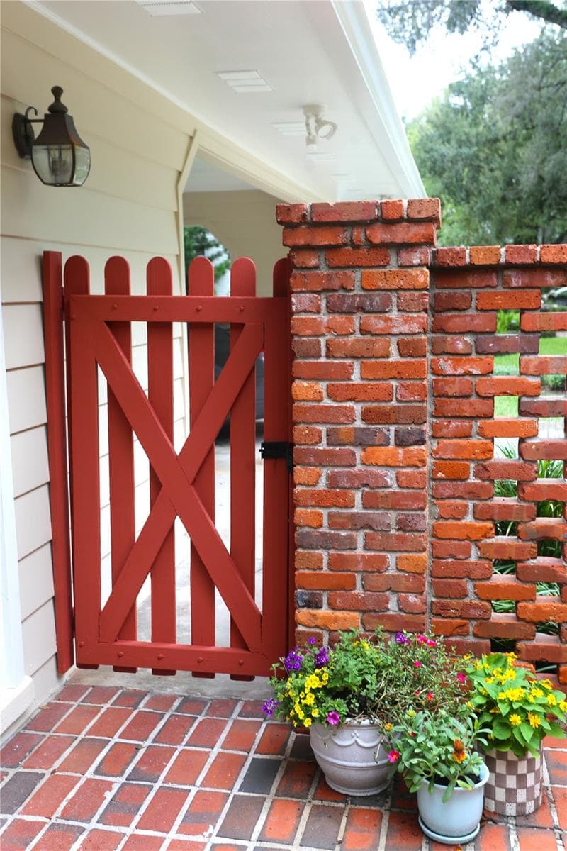 Gate from the Courtyard leading to the Two Car Carport with 6 x 16 Workshop. - 4414 W WATROUS AVE, TAMPA