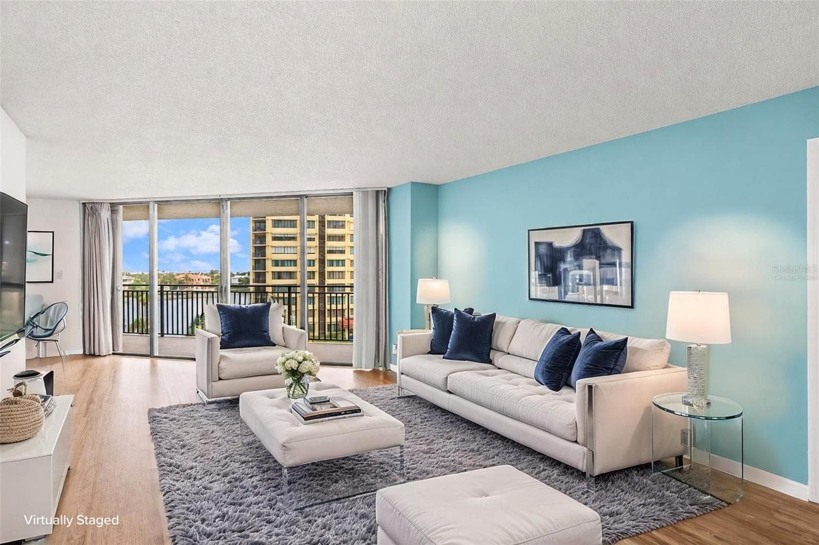 Living room, furniture virtual staging. Views are fabulous - 690 ISLAND WAY #606, CLEARWATER