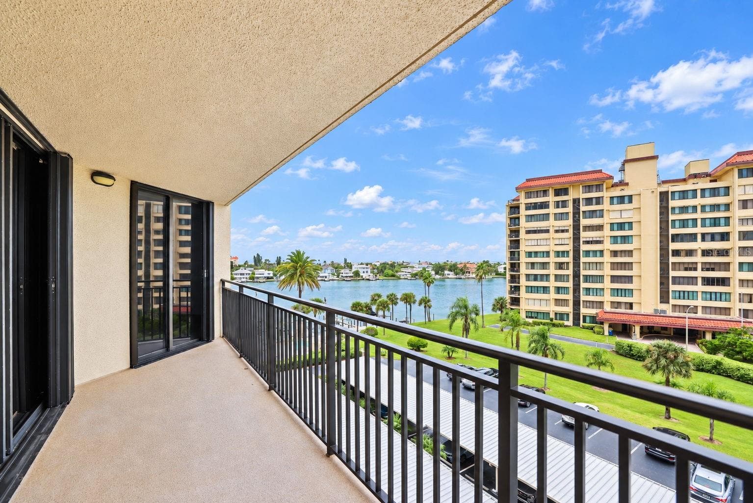 Large Patio undercover. New railings and non-skid flooring. I've seen dolphins from here. Facing West - 690 ISLAND WAY #606, CLEARWATER