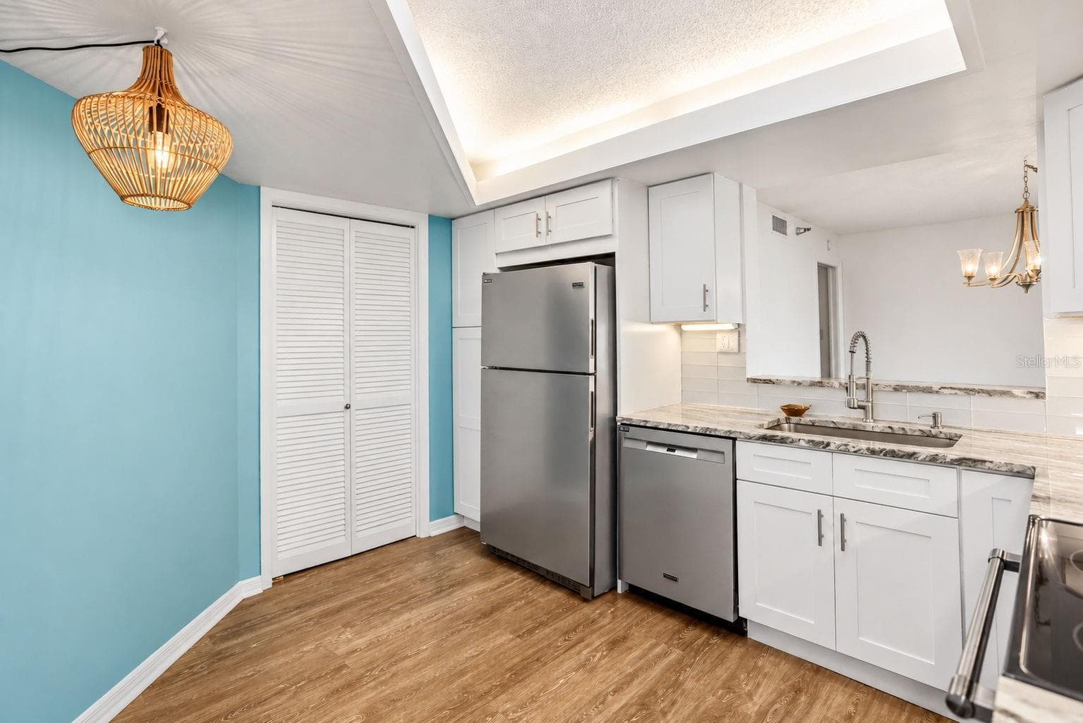 Kitchen remodel includes pantry closet and extra pantry next to the refrigerator. - 690 ISLAND WAY #606, CLEARWATER