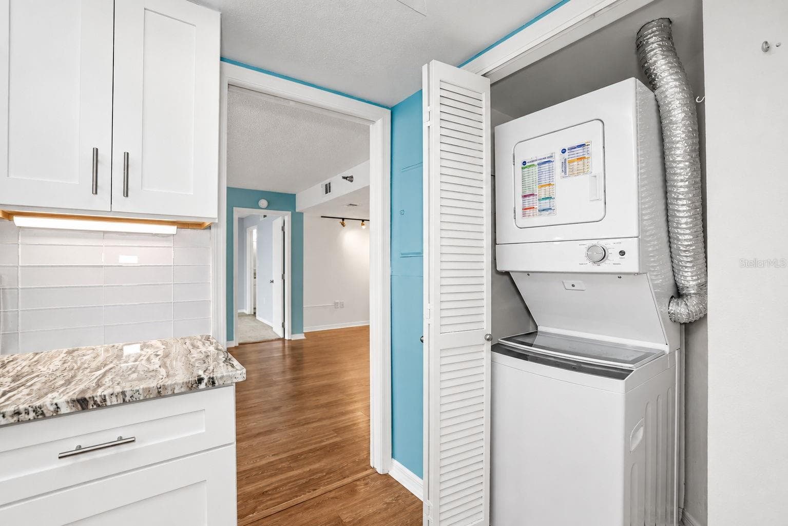Notice pretty glass subway tiles and Washer Dryer conveniently located in the unit - 690 ISLAND WAY #606, CLEARWATER