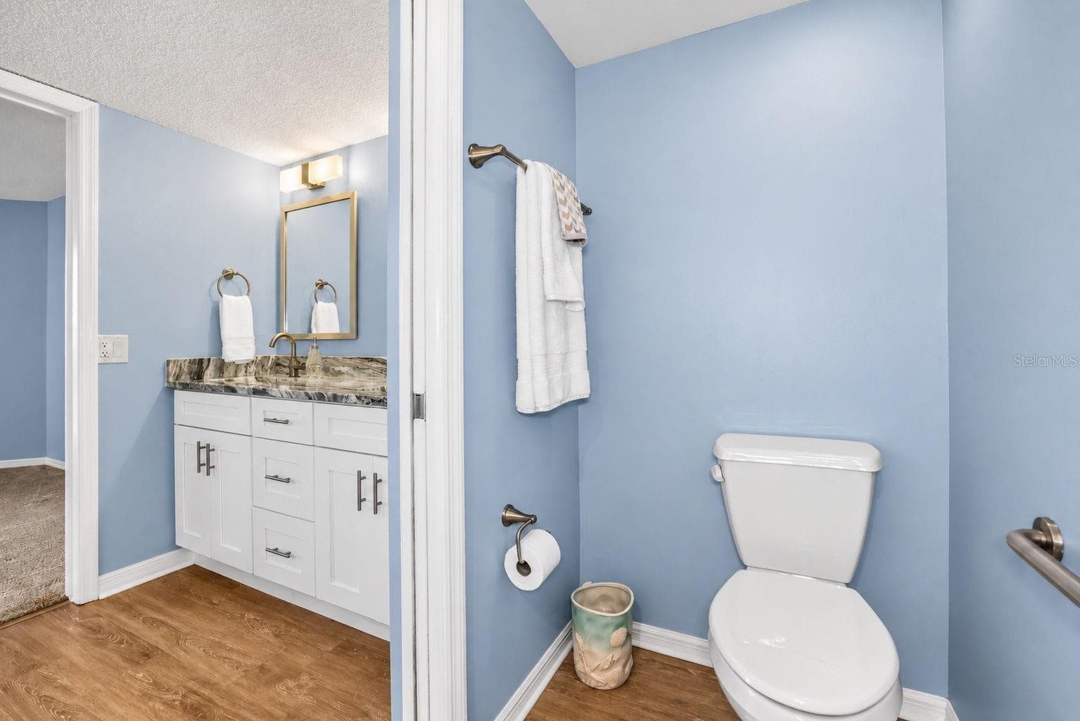 Primary Bathroom, newly updated with double sink shaker cabinet vanity with soft close drawers, lighting, mirrors and paint. - 690 ISLAND WAY #606, CLEARWATER
