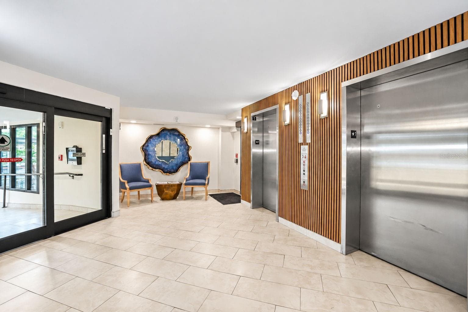 Lobby update showing 2 elevators.  The building has a generator to run elevators in case of power outage. - 690 ISLAND WAY #606, CLEARWATER
