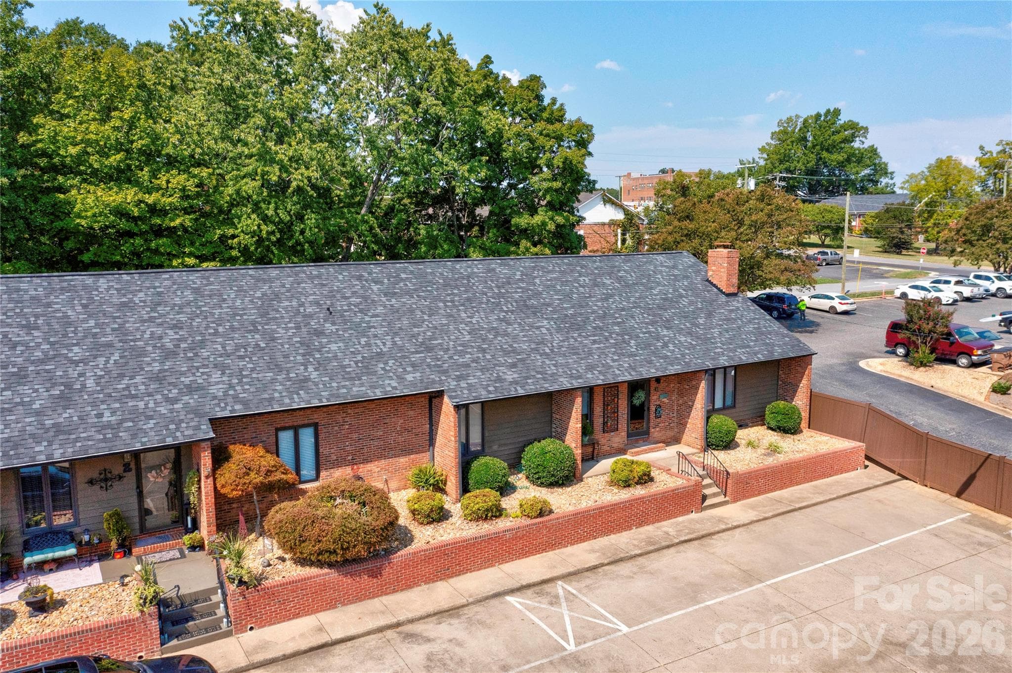 Tucked privately in this quaint townhome village.  Easy walk to uptown stores and restaurants. - 301 Pinkney Street, Shelby