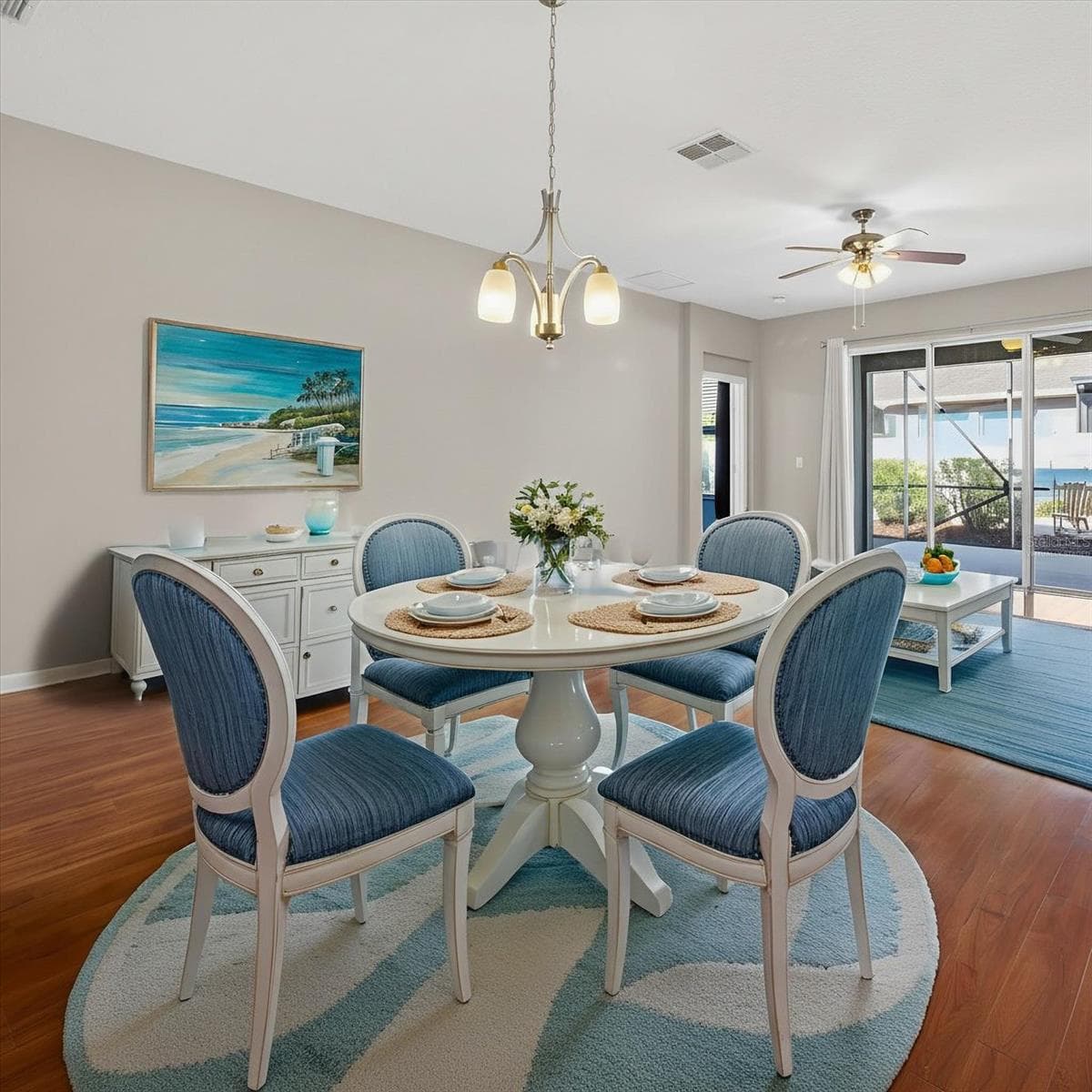 Virtually staged dining and living area to illustrate furniture placement. - 2153 BARRACUDA CT, HOLIDAY