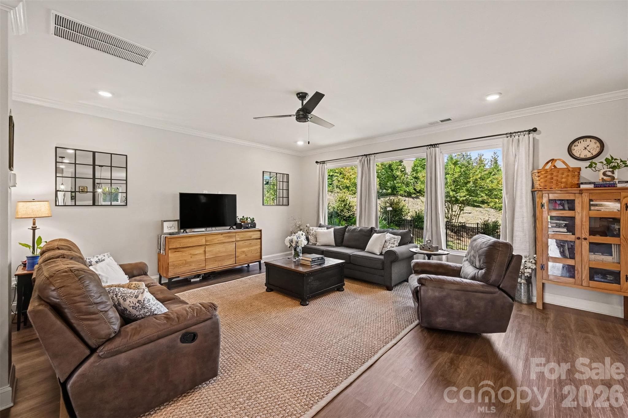 Big windows bring in natural light and leafy views all day long. - 2703 Wedgewood Court, Denver
