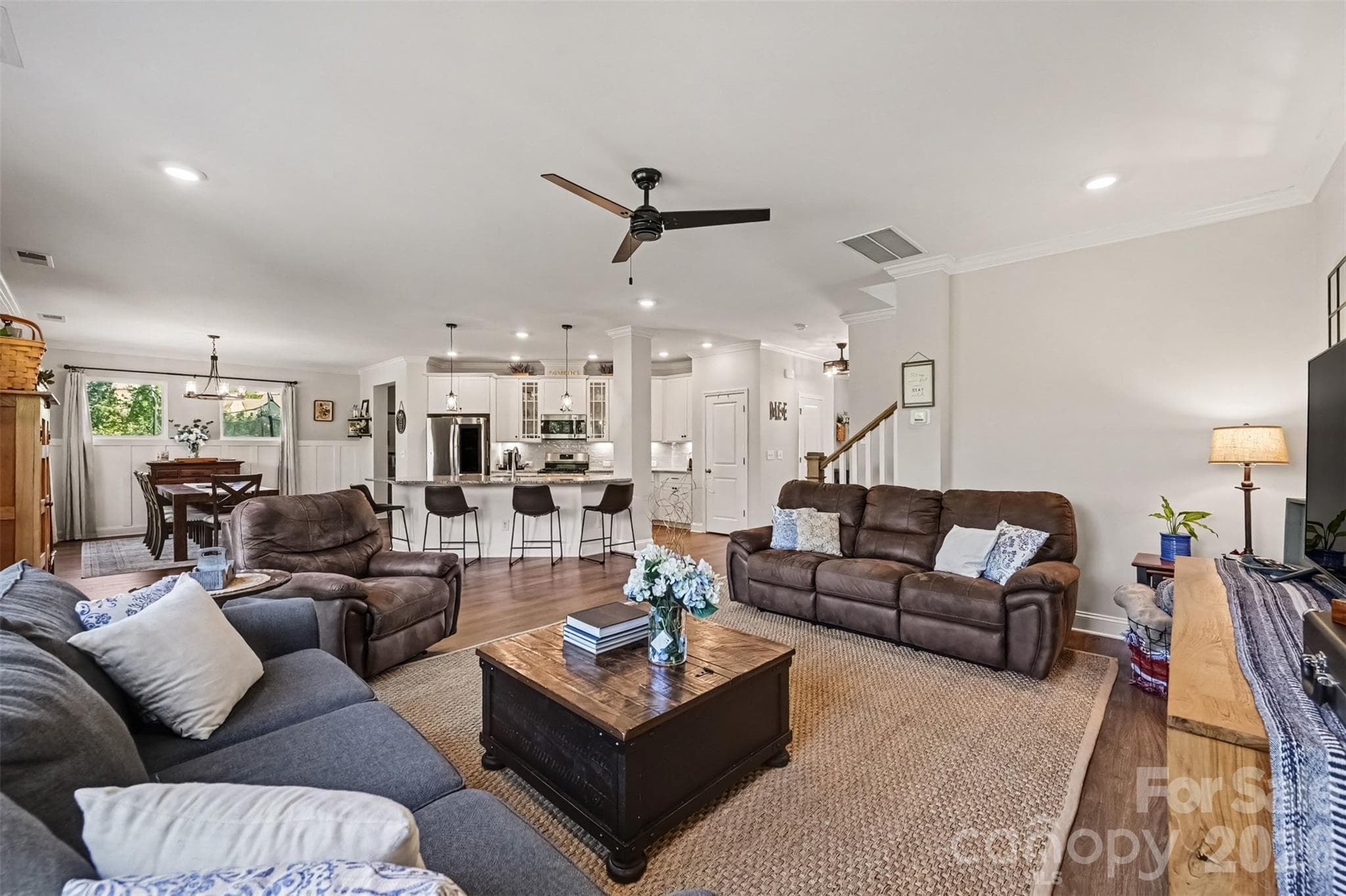 The family room opens right into the kitchen and dining area, so nobody gets stuck in another room. - 2703 Wedgewood Court, Denver