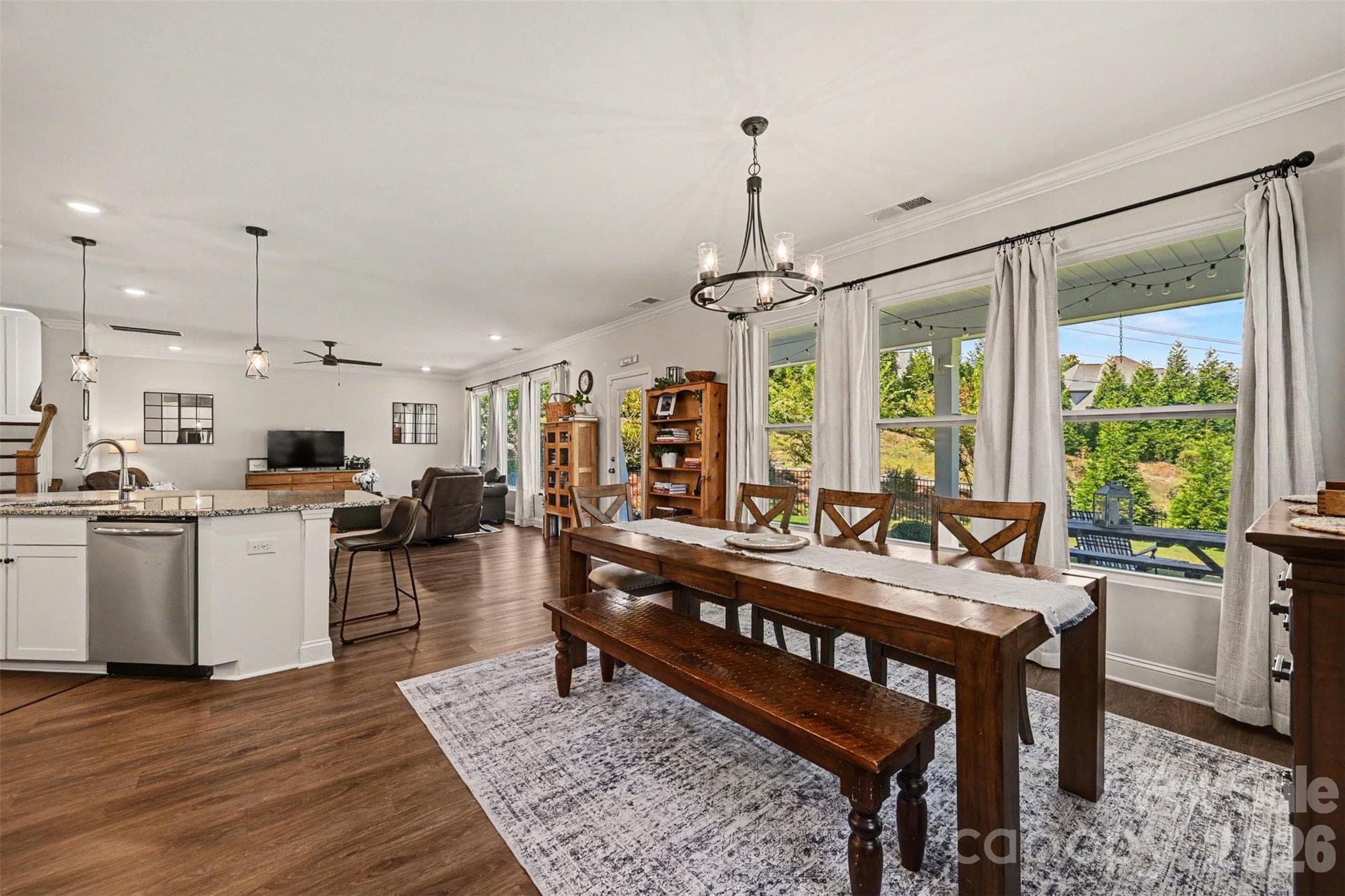 The dining area flows right into the kitchen, which makes hosting easy. - 2703 Wedgewood Court, Denver