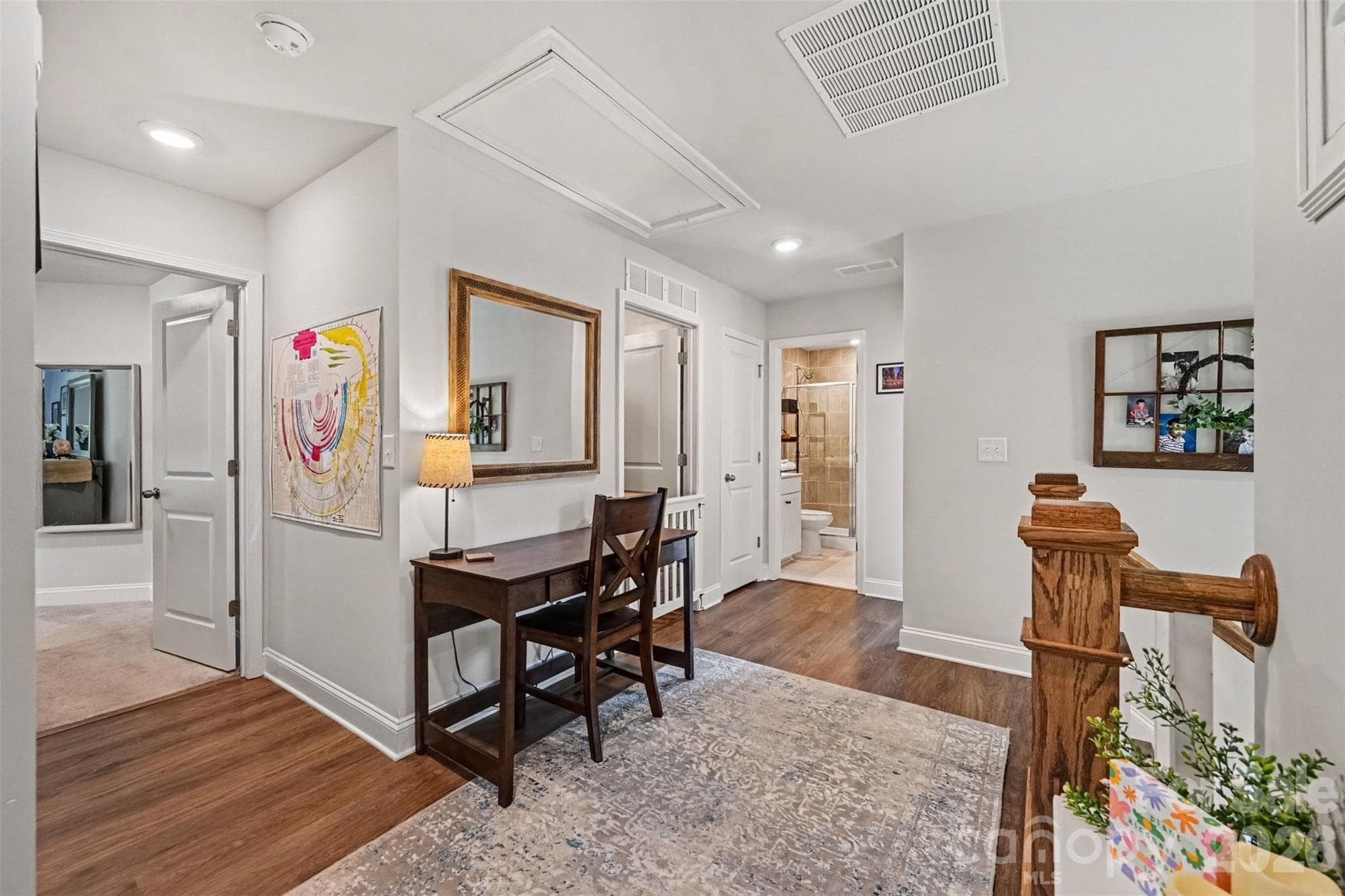 The loft keeps the upstairs open and airy, with the bedrooms just steps away. - 2703 Wedgewood Court, Denver