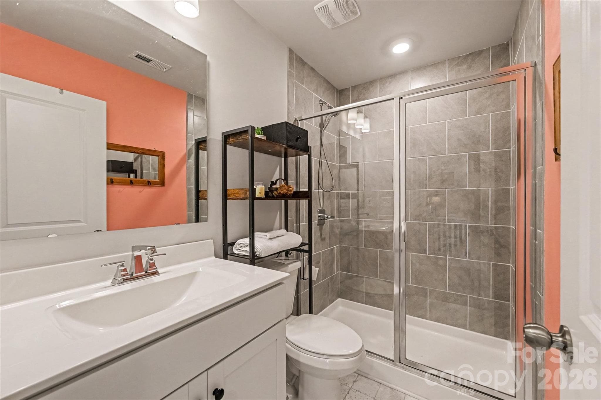 A full bath with a glass-enclosed walk-in shower. - 2703 Wedgewood Court, Denver