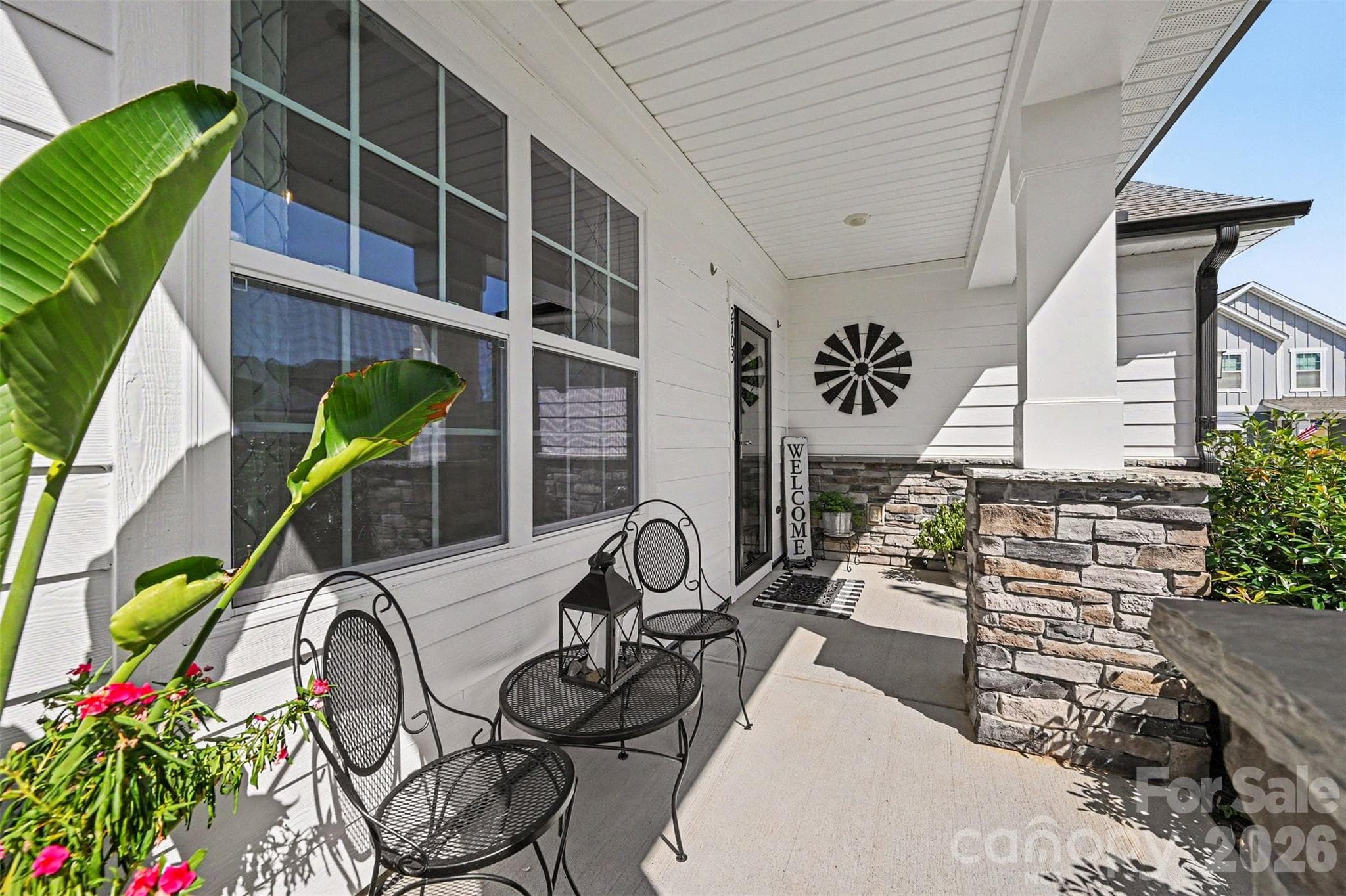 A charming covered front porch, perfect for morning coffee or winding down in the evening. - 2703 Wedgewood Court, Denver